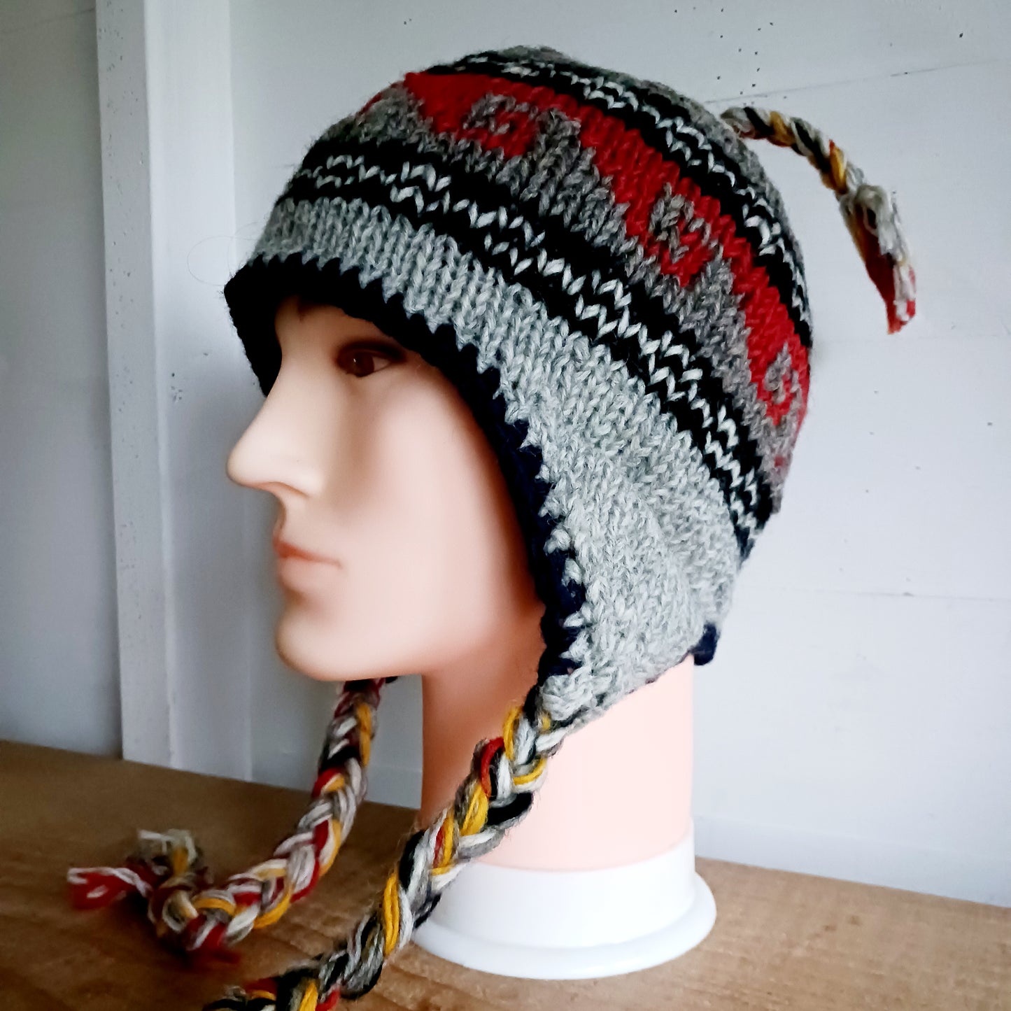 Stay cozy and stylish with our handmade chunky wool earflap hats, crafted in Nepal by skilled women artisans in Kathmandu. Each hat is 100% pure wool and features a soft polar fleece lining for extra warmth and comfort. Perfect for cold winter days, outdoor adventures, or adding a touch of handmade charm to your look.