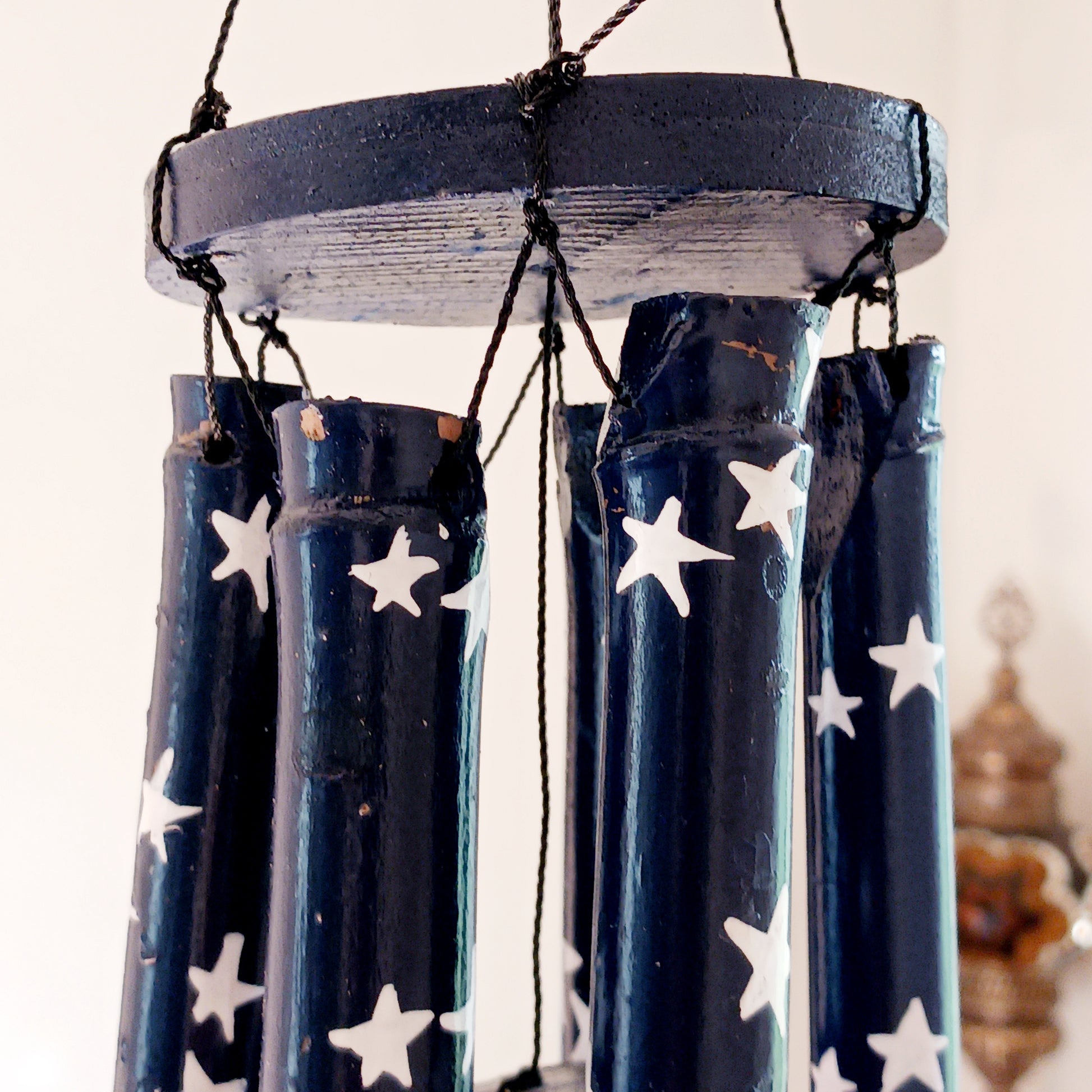 This great sounding bamboo windchime is perfect for hanging in a tree or from a wall in your garden, or even in your bedroom! This windchime has been hand painted in a calming night sky design - bringing calm to whichever place you hang it.