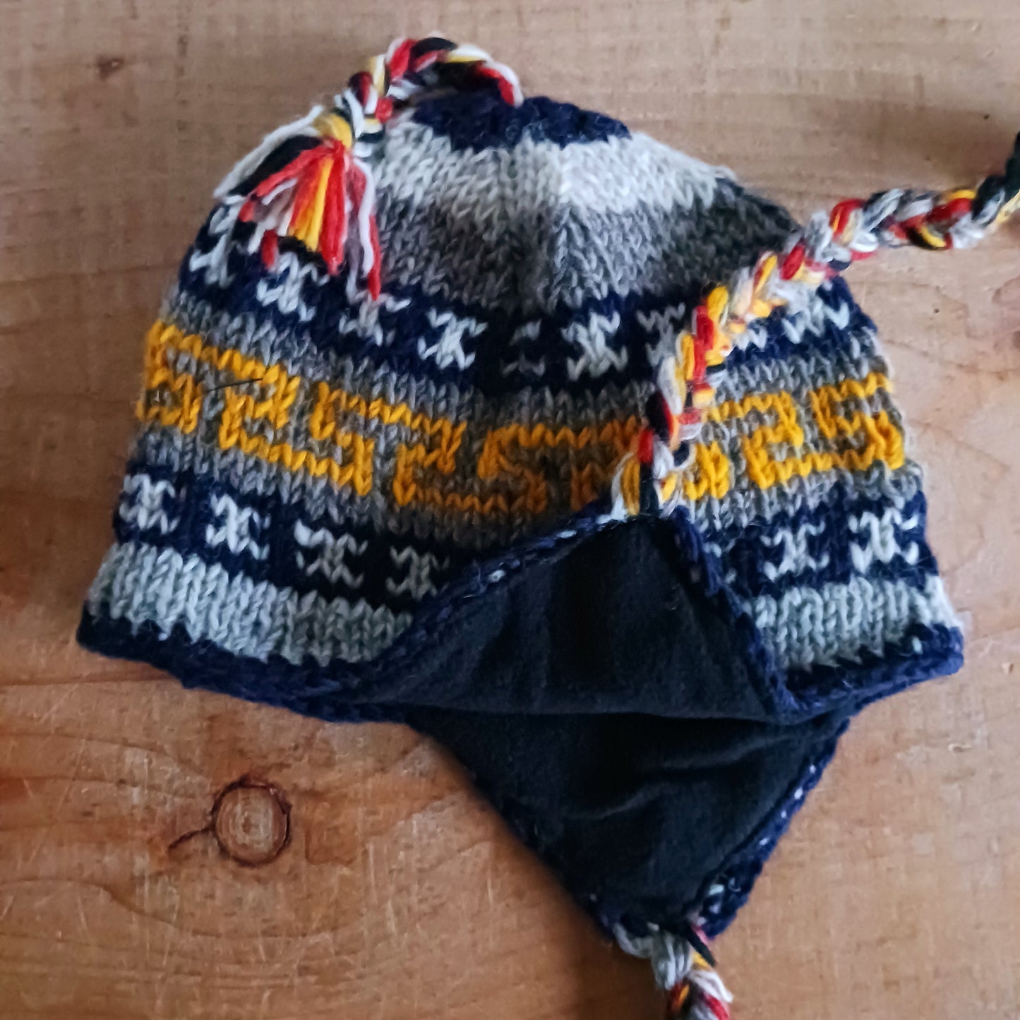 Stay cozy and stylish with our handmade chunky wool earflap hats, crafted in Nepal by skilled women artisans in Kathmandu. Each hat is 100% pure wool and features a soft polar fleece lining for extra warmth and comfort. Perfect for cold winter days, outdoor adventures, or adding a touch of handmade charm to your look.