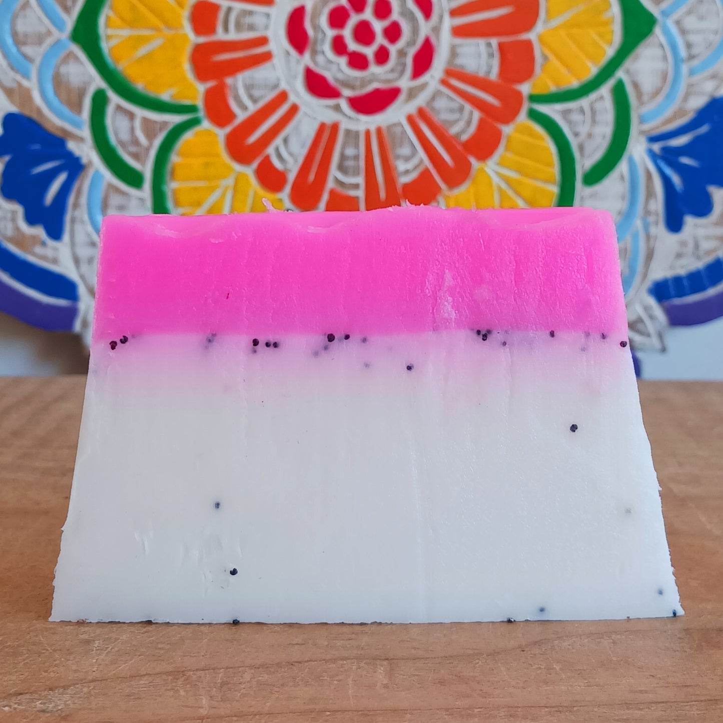 Treat yourself to a tropical burst of fragrance with this wonderful Dragon Fruit Handmade Soap. Lovingly made using the melt-and-pour method, this beautifully scented soap combines a delicious dragon fruit fragrance with poppy seeds to provide a gentle exfoliating scrub that helps remove dead skin, leaving hands and body feeling smooth, refreshed and nourished.
