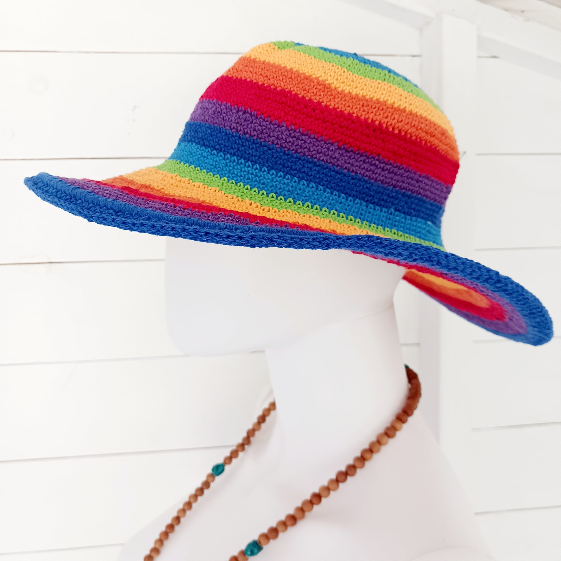 Add a splash of colour to your summer wardrobe with this beautiful Handmade Rainbow Crochet Cotton Sun Hat. Carefully handcrafted, this vibrant hat is designed to keep you comfortable while making a bold statement wherever your adventures take you.