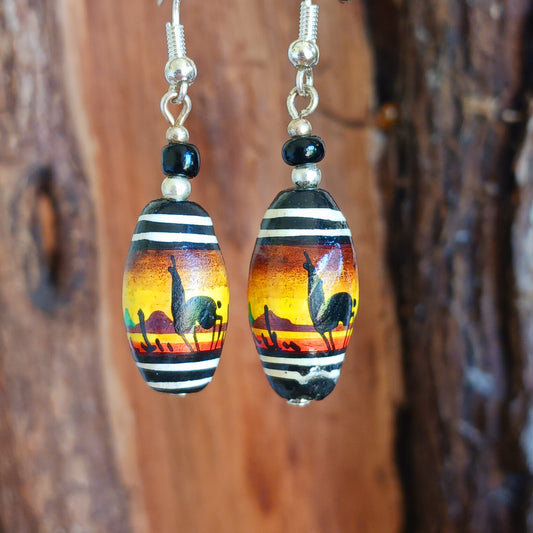 A stunning sunset design adorns this pair of earrings, hand painted on clay beads from Cusco, Peru. And no Peru design would be complete without some llamas added in! Each pair is carefully hand assembled in the Kent countryside and uses silver plated fixings.