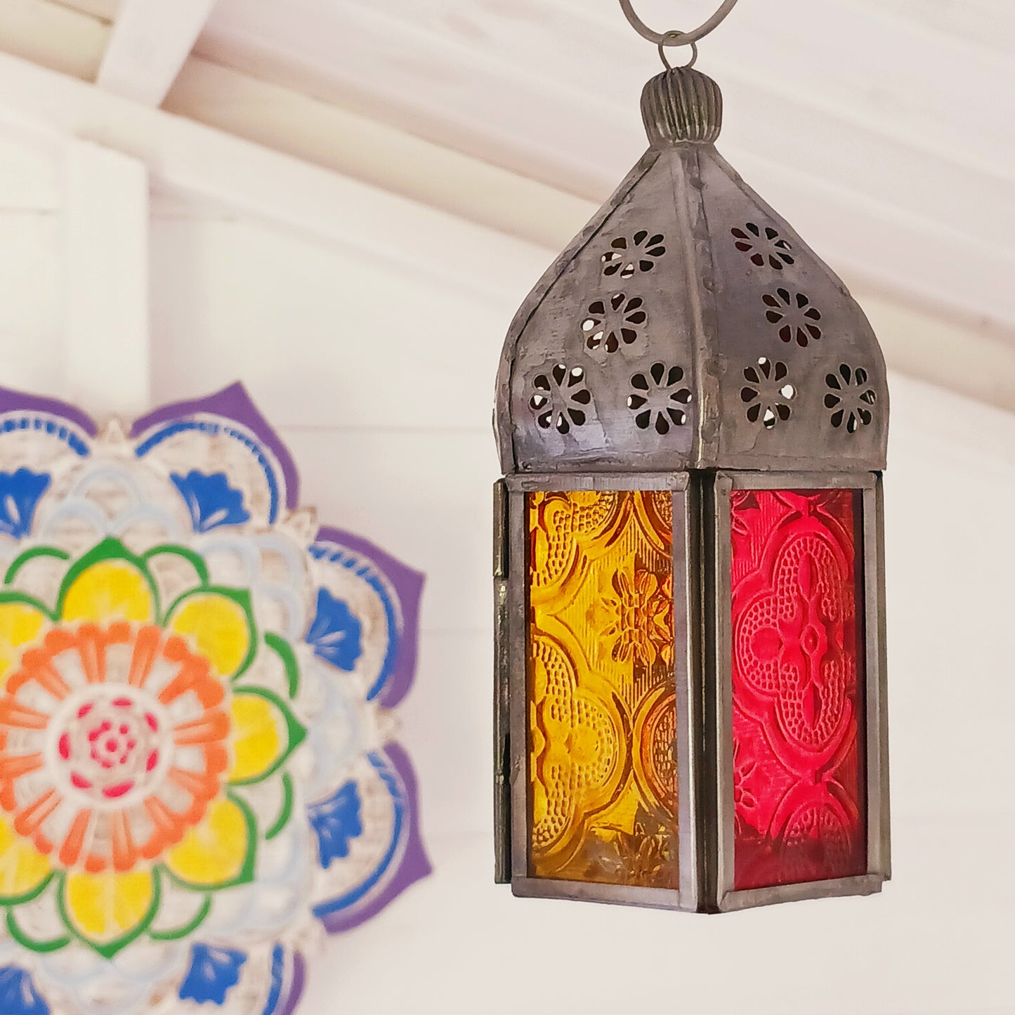 These small glass lanterns come in wonderful colours, featuring an intricate embossed pattern. They have a small hinged door that closes with a sliding catch. The small handle on the top is great for hanging the lanterns around your home. Perfect for adding a touch of warmth to your space.