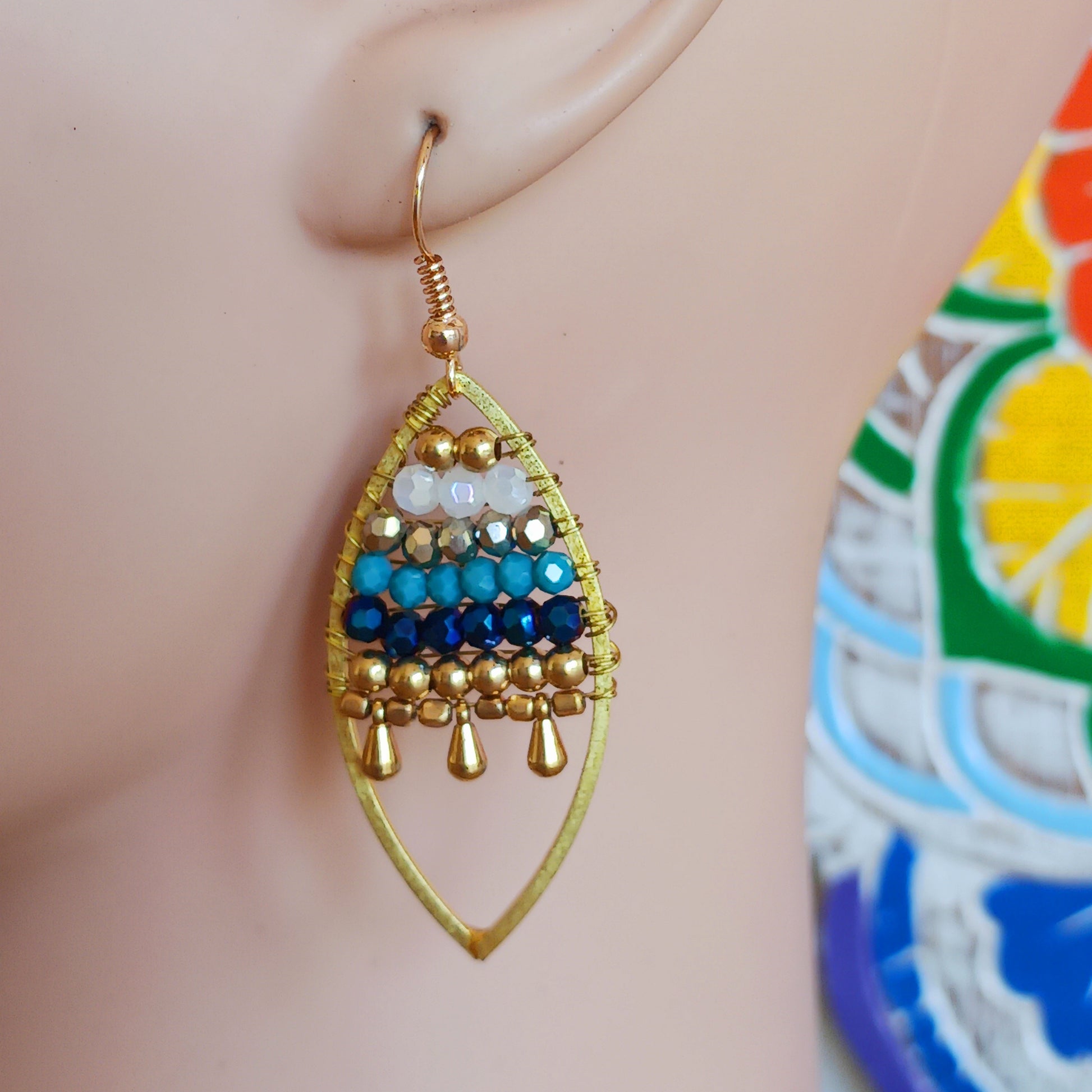 These pretty beaded earrings are so bohemian chic and add effortless style to your outfit. The beads sparkle gently when the light catches them, making them a great evening accessory as well as daytime. They are finished with gold plated hooks.