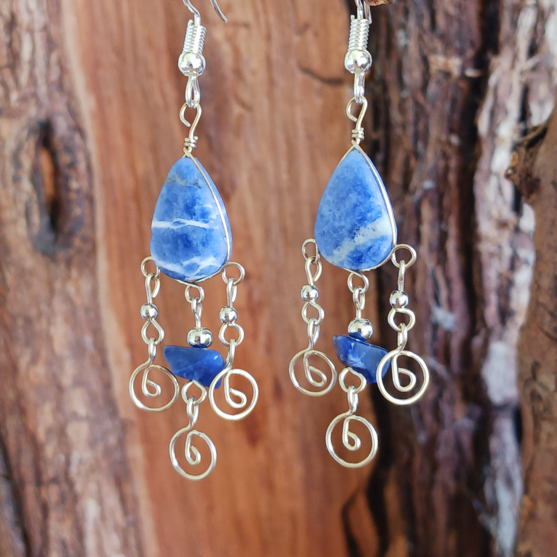 These beautiful spiral earrings feature a lapis lazuli stone and three spirals. They dangle really nicely when worn, and are easy to dress up or down.  The hooks are made from sterling silver so will be something that you can wear season after season.