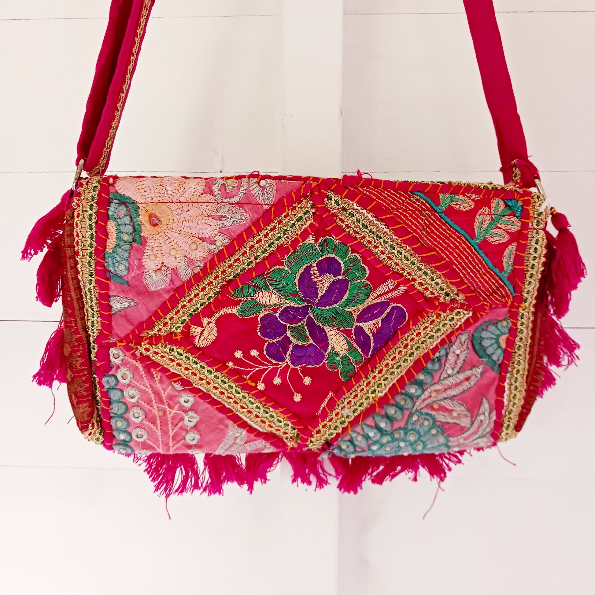 Add a vibrant touch to your everyday style with this beautifully handmade Indian embroidered handbag, crafted from upcycled materials for a truly sustainable fashion statement.