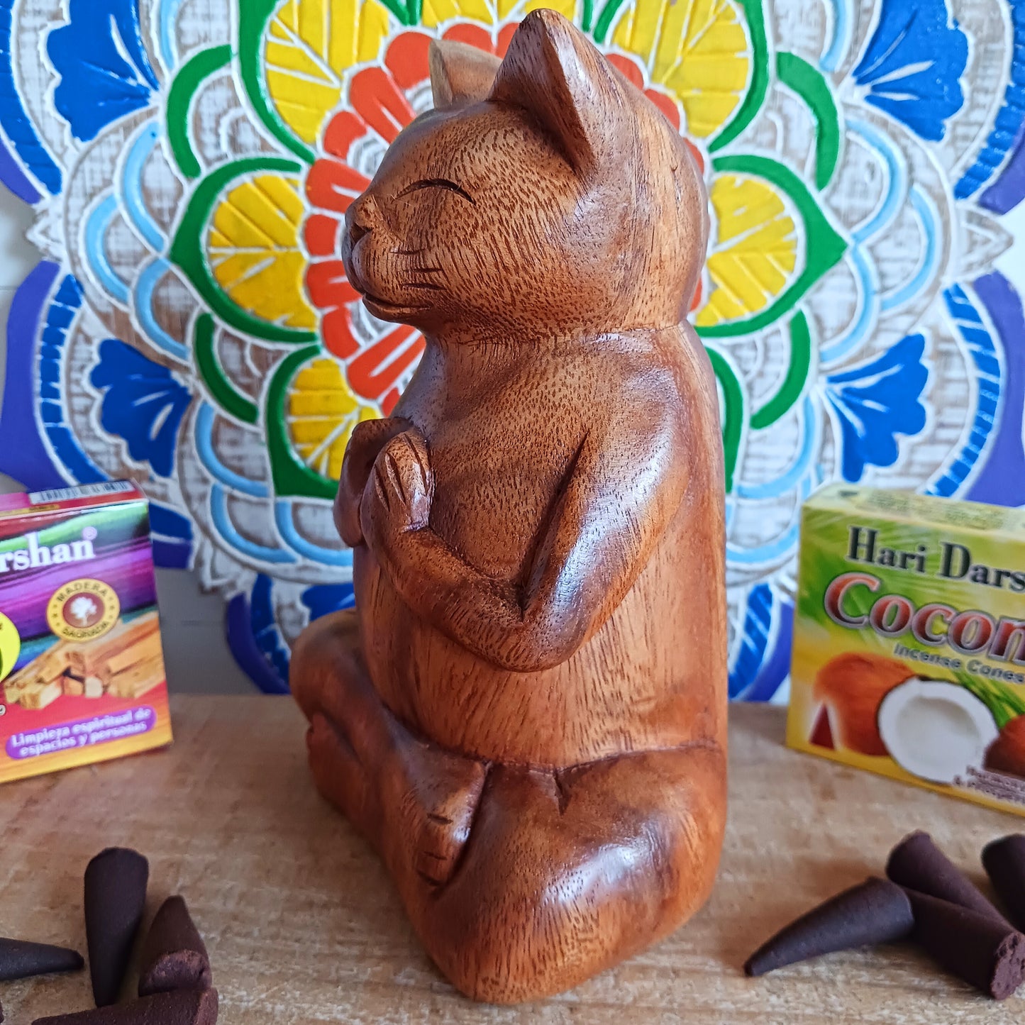Bring a sense of peace, playfulness, and artistry into your space with this Hand-Carved Wooden Yoga Cat Incense Burner. Each piece is lovingly crafted by skilled Indonesian artisans from sustainably sourced Suar wood, showcasing the perfect blend of mindfulness and feline charm.
