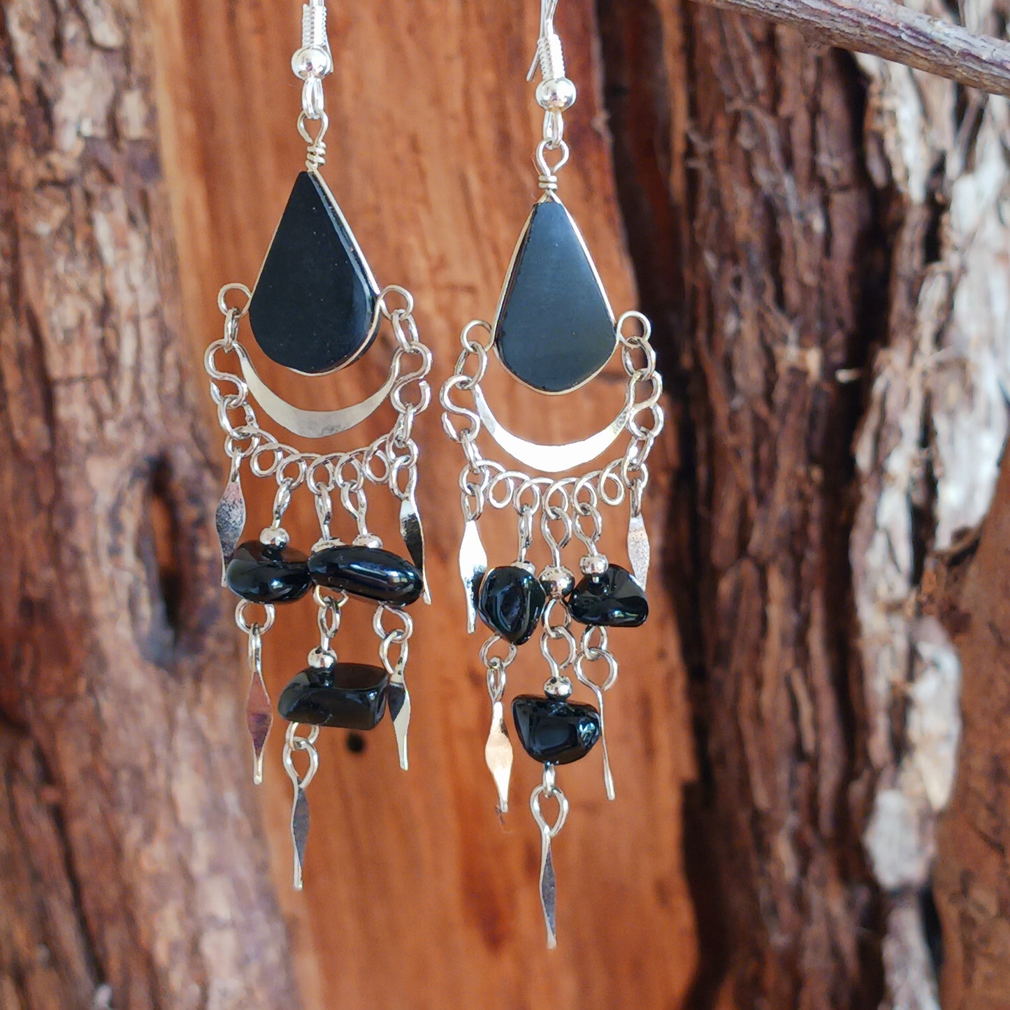 Add a touch of bohemian beauty to your look with these handmade Peruvian stone earrings. Featuring black stones and finished with silver-plated hooks, each pair is carefully crafted in small workshops in Peru.