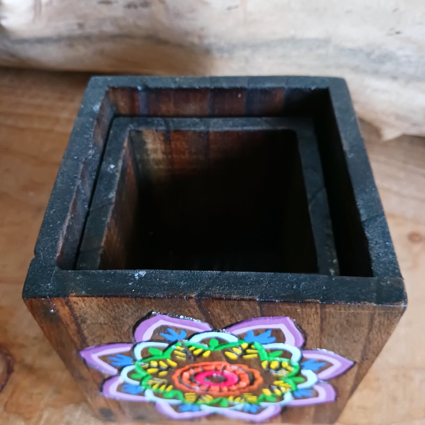 Add a burst of colour and joy to your space with this Hand Painted Mandala Wooden Pots Set, handmade in Indonesia and Fairtrade certified. Each pot is carefully painted by skilled artisans, making every set unique and full of character.