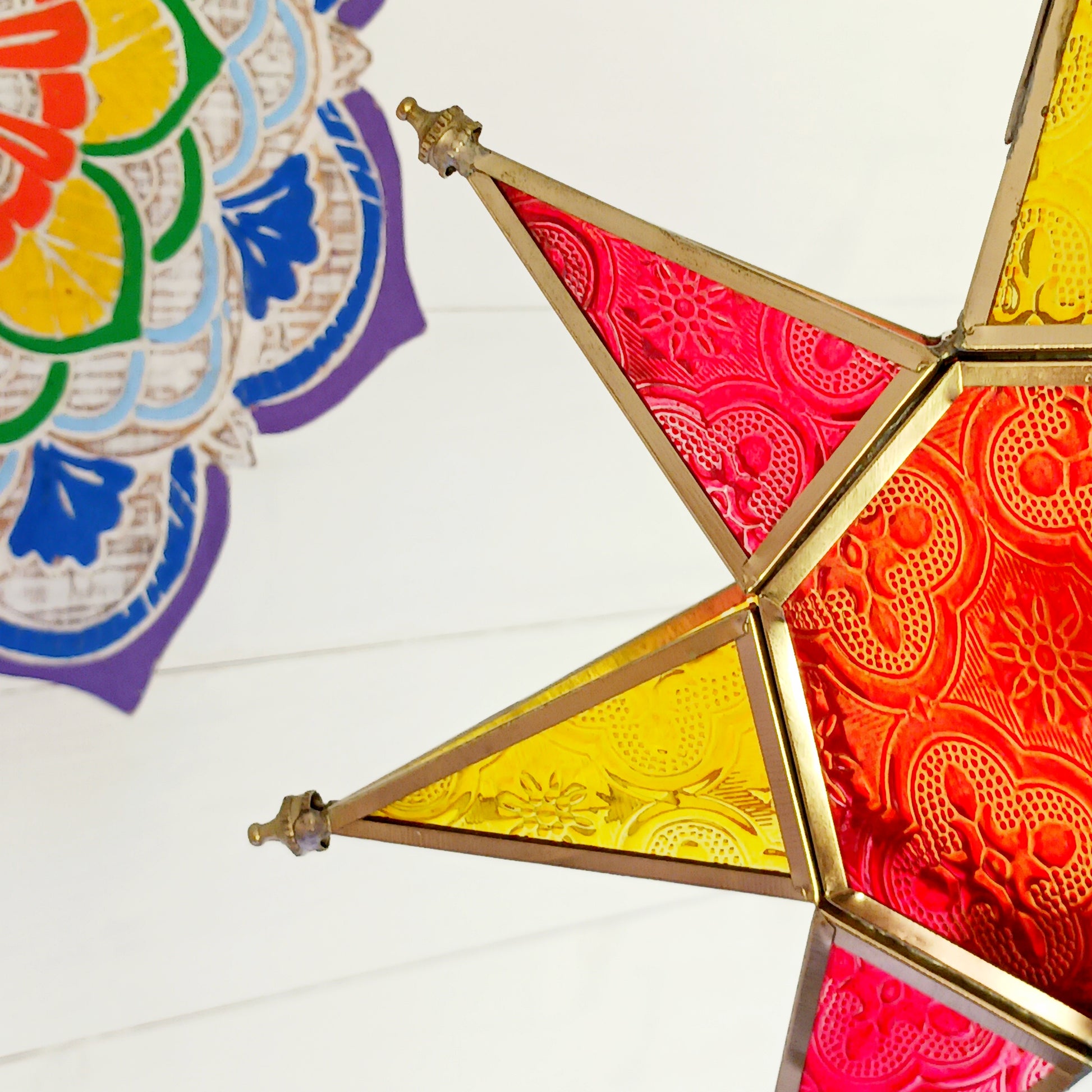 These Moroccan style star glass lanterns are handcrafted by skilled artisans and come in beautiful rich colours that catch the eye and instantly add atmosphere to any room.