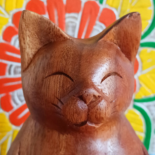 Bring a sense of peace, playfulness, and artistry into your space with this Hand-Carved Wooden Yoga Cat Incense Burner. Each piece is lovingly crafted by skilled Indonesian artisans from sustainably sourced Suar wood, showcasing the perfect blend of mindfulness and feline charm.