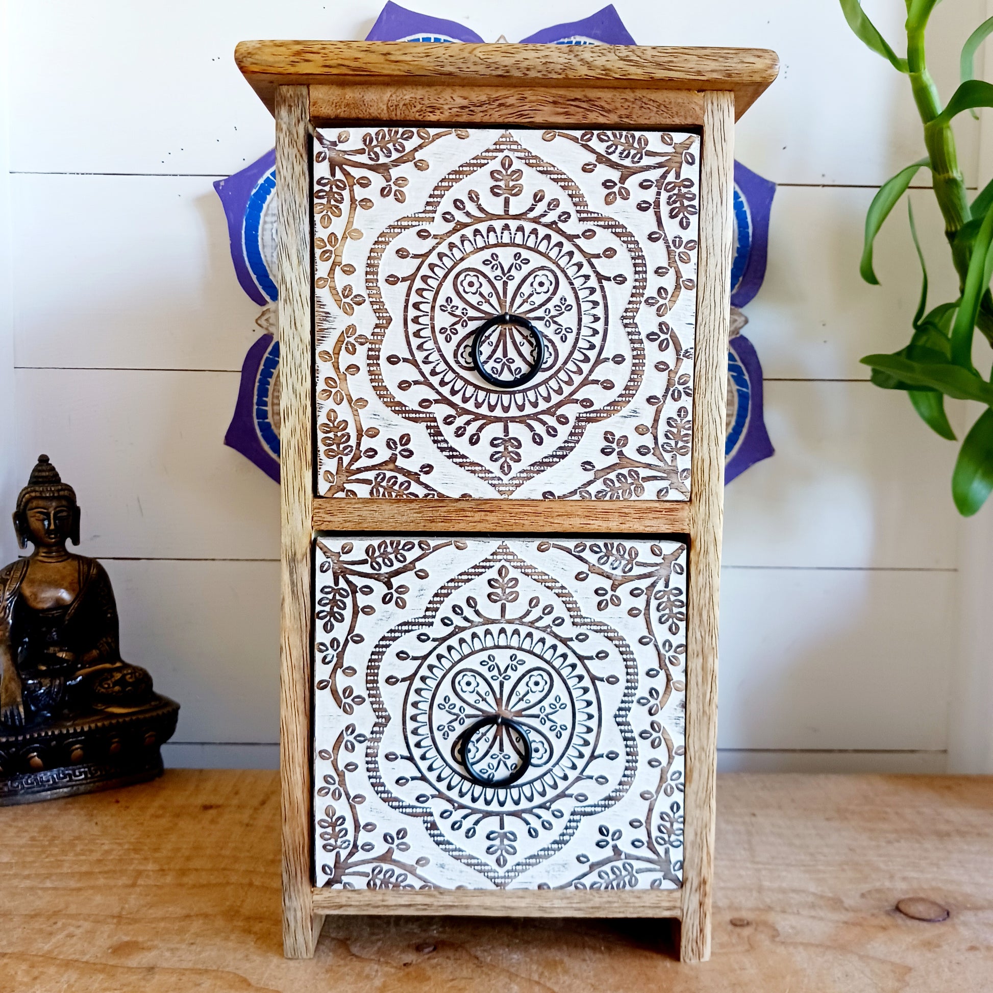 Bring balance and beauty to your space with this handcrafted mango wood drawer cabinet, featuring an intricate mandala design on the front panels. Perfect for organising your wellness accessories, stationery, jewellery, or essential oil droppers, this piece combines practicality with mindful artistry. 