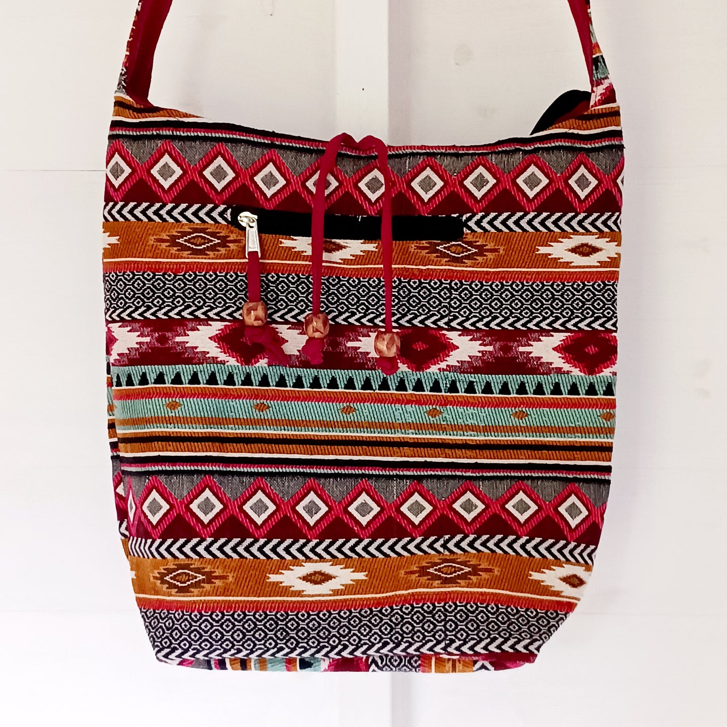 Bring vibrant artisan style to your everyday adventures with this Jacquard Nepal Sling Bag. Designed in a traditional Nepal-inspired jacquard pattern, this beautifully crafted bag is the ideal size for carrying all your personal belongings comfortably.