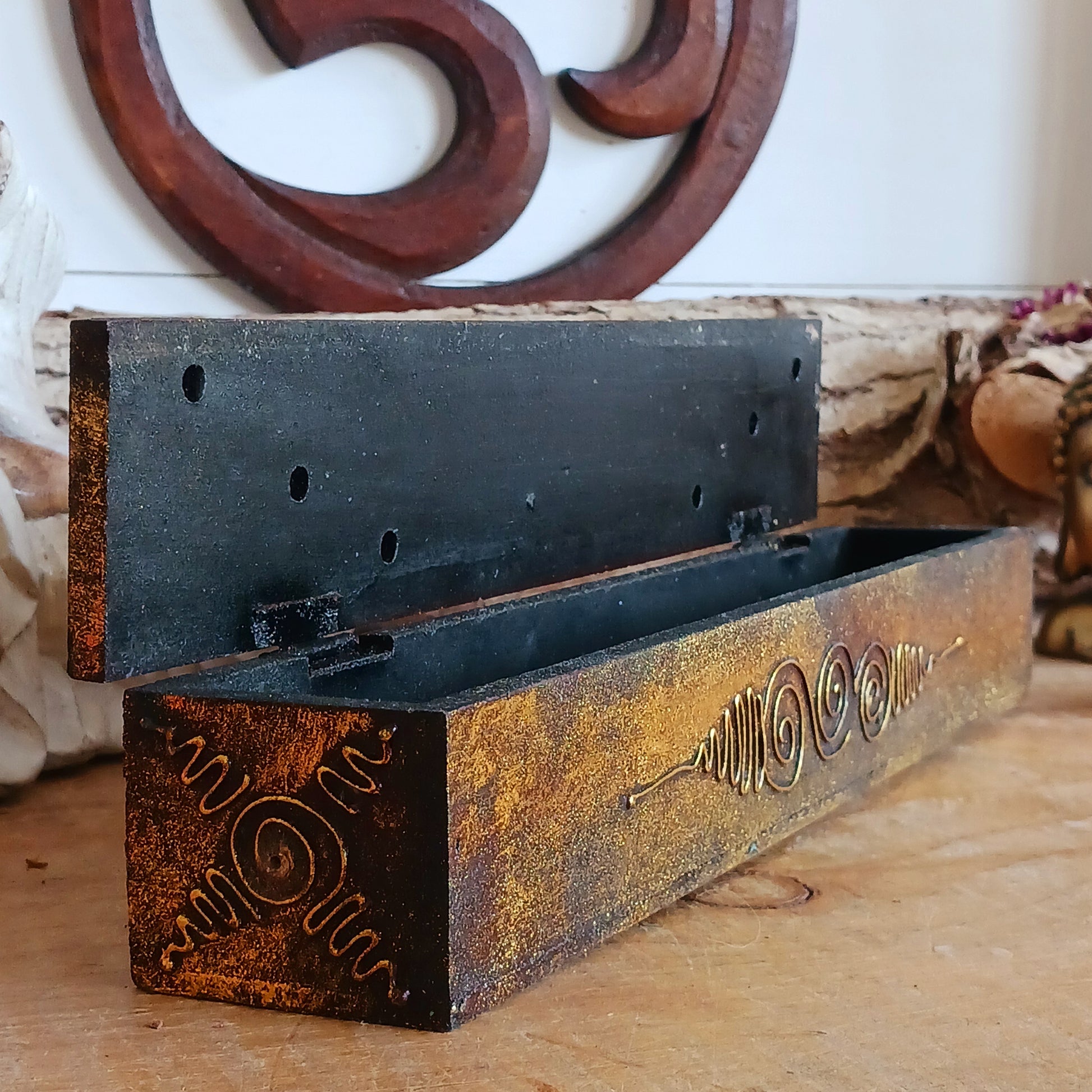 This unique incense stick holder is perfect to catch the ash from your favourite incense. It has been handmade from responsibly sourced wood, skillfully carved and decorated with a centre OM symbol.