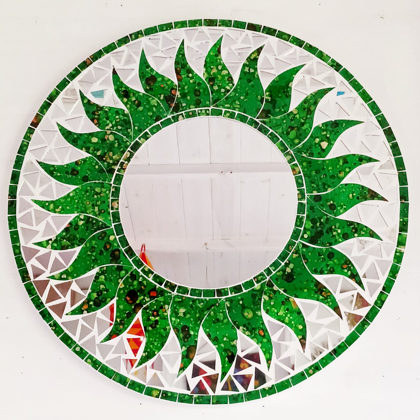 Add warmth, energy, and artistic charm to your home with this beautiful Vibrant Green Mosaic Sun Mirror. Designed with dazzling green mosaic tiles arranged in a radiant sunburst pattern, this captivating wall accent instantly brightens any room.