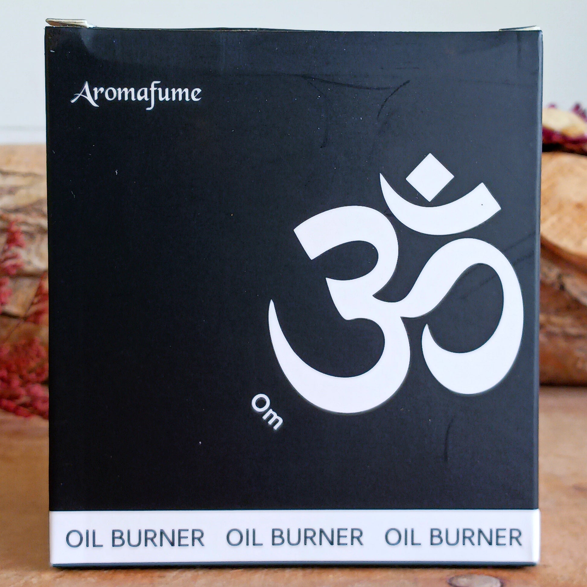 The Aromafume Om Oil Burner is a beautifully crafted ceramic burner featuring the sacred Om symbol, representing universal sound, unity, and spiritual awareness. 