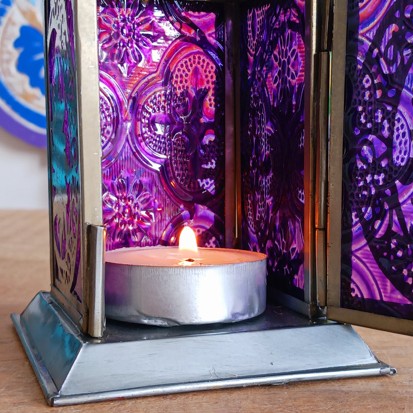 Bring warmth, colour and spiritual harmony to your home with this beautiful Moon & Stars Glass Lantern. Designed with vibrant coloured glass panels and a decorative metal cut-out canopy, this lantern creates a calming glow that enhances meditation spaces, yoga rooms and home décor.