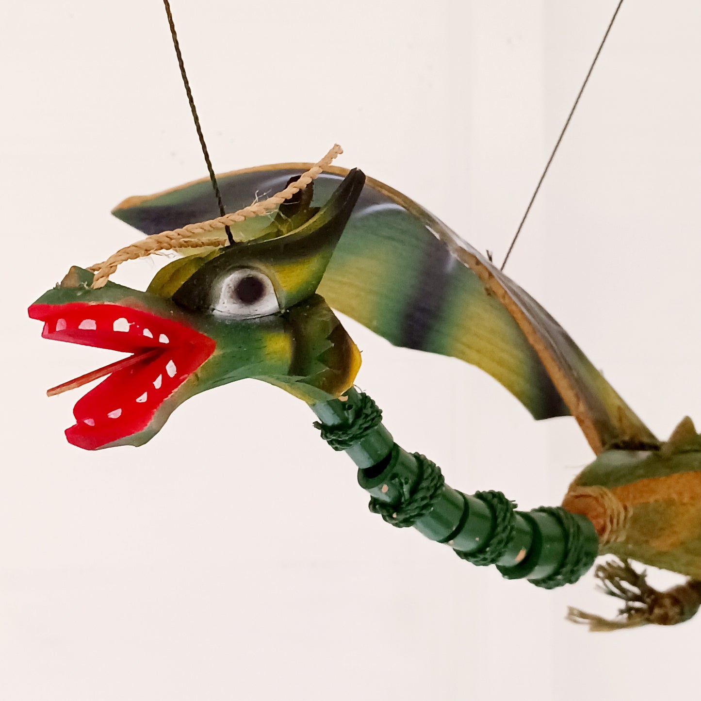 Bring a touch of magic and movement to your home or garden with this Large Green Coconut Dragon Mobile, a beautifully handcrafted decorative piece handmade in Indonesia.