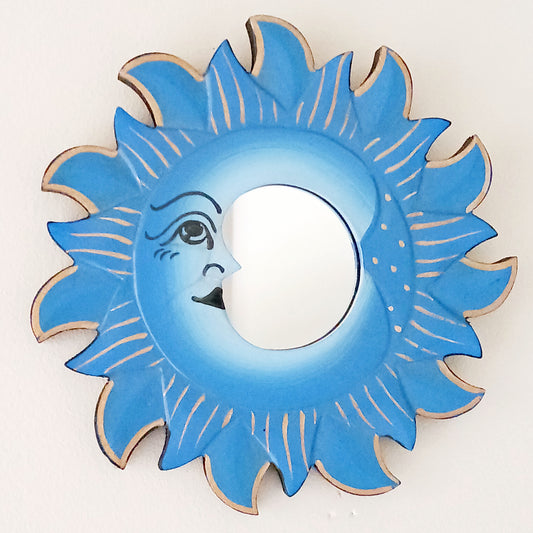 Elevate your home with our Little Sun &amp; Moon Mirror, a mystical and spiritual accent handmade by fairtrade artisans. Featuring an enchanting sun and moon design, this unique piece brings positive energy, balance, and harmony into any space. Perfect for adding a touch of celestial charm to your walls, this mirror doubles as meaningful décor and a symbol of light and reflection.
