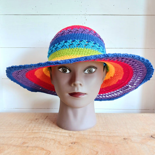 Handmade rainbow crochet sun hat with a flexible brim. Perfect for holidays, beach days & festivals. Unique, lightweight, and ready for sunny adventures!