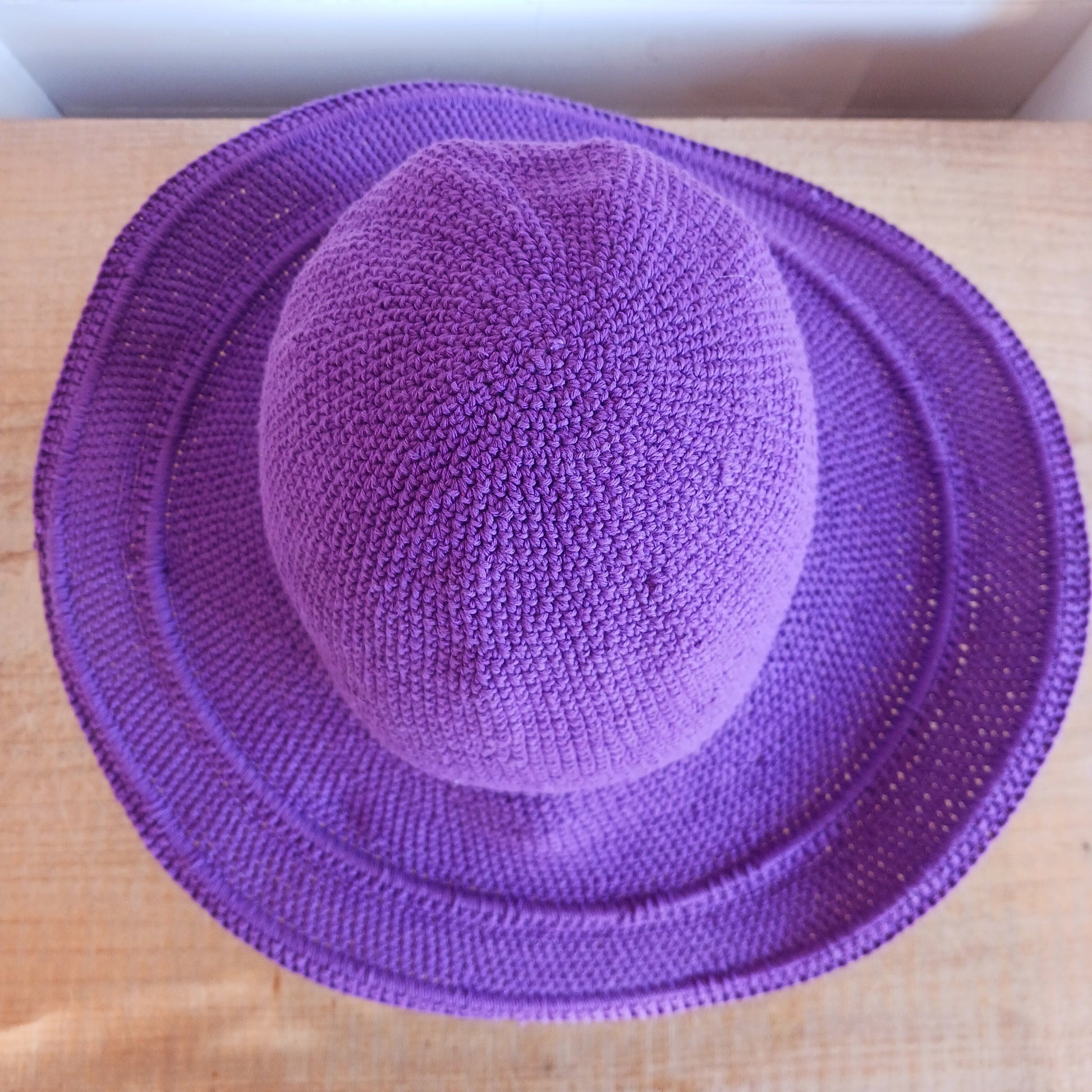 This lovely crochet cotton summer sun hat is perfect for summertime with it's vibrant purple colour.  Each hat has a malleable wire woven into the rim to help keep the shape.  Ideal for holidays and festivals.