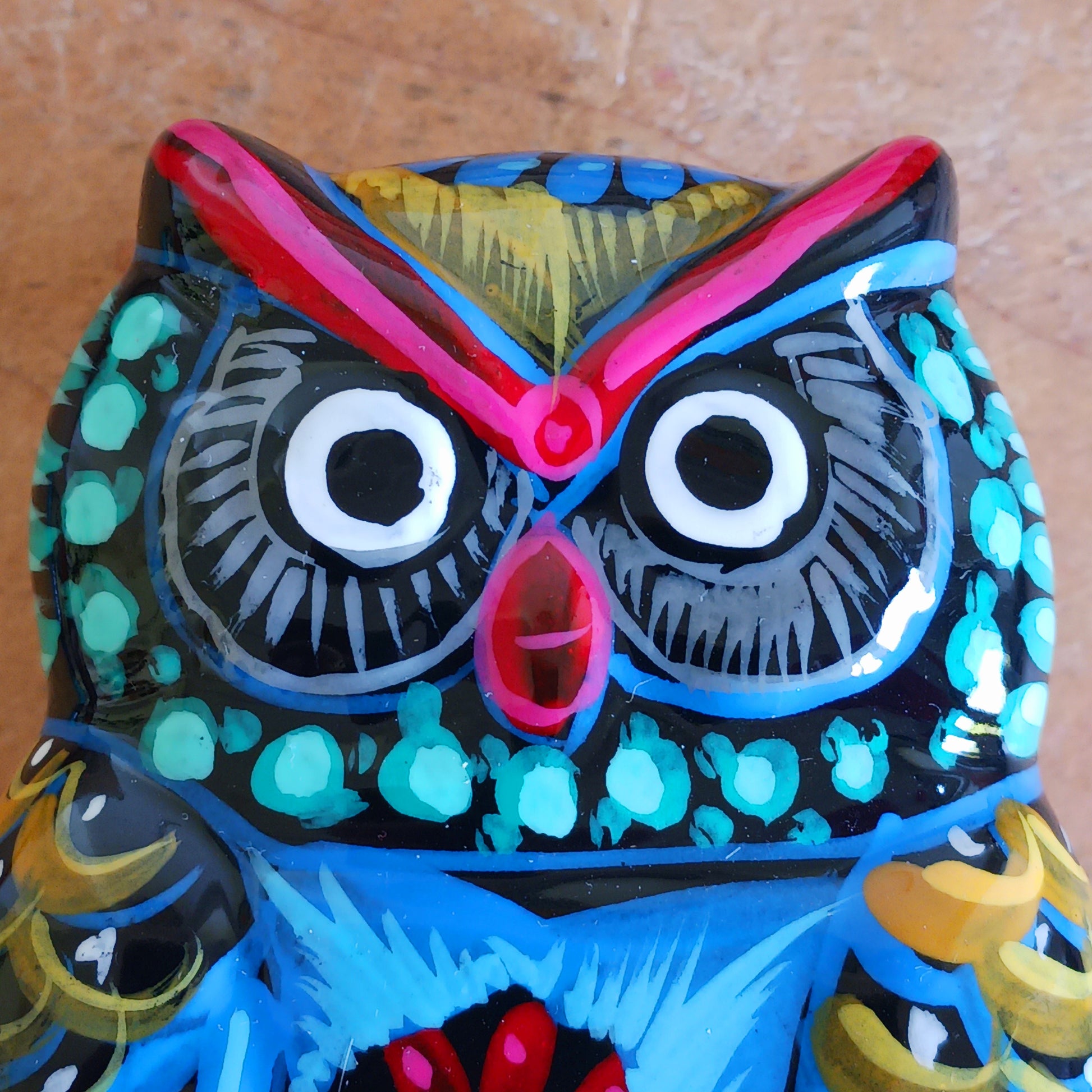 Bring a burst of colour and culture into your home with this beautifully hand-painted owl trinket pot, a unique piece that blends functionality with traditional artistry.