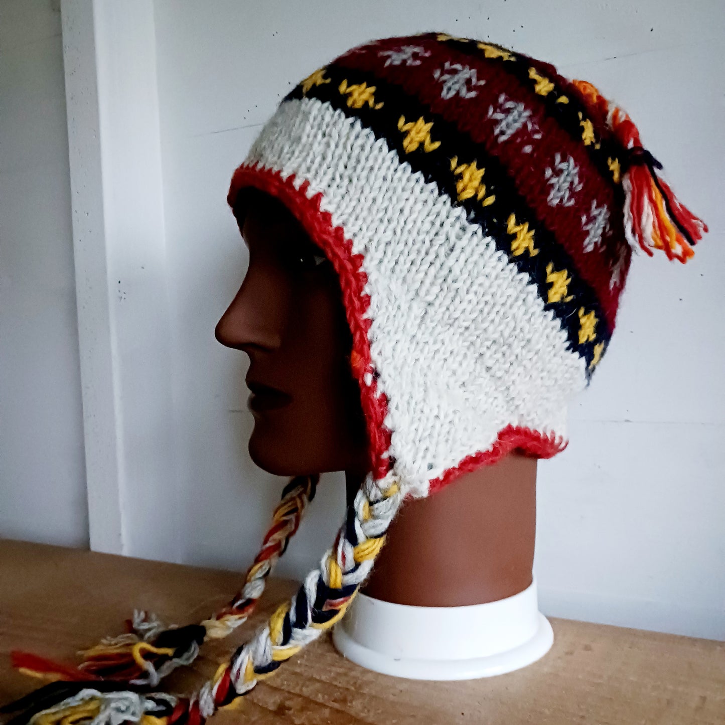 Stay cozy and stylish with our handmade chunky wool earflap hats, crafted in Nepal by skilled women artisans in Kathmandu. Each hat is 100% pure wool and features a soft polar fleece lining for extra warmth and comfort. Perfect for cold winter days, outdoor adventures, or adding a touch of handmade charm to your look.