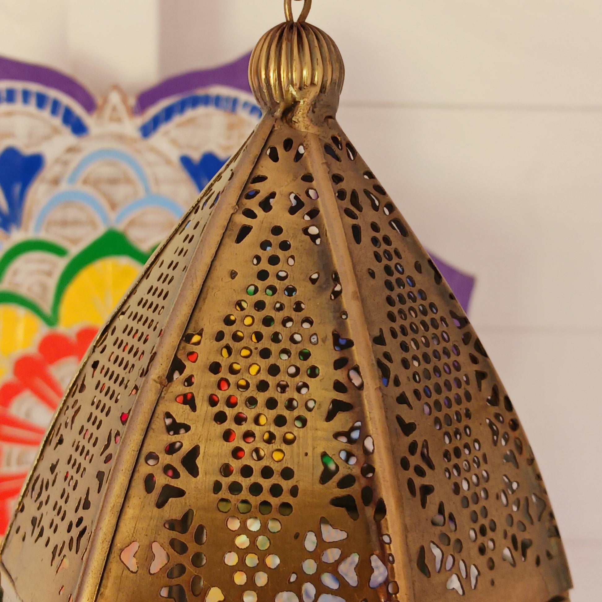 This antique brass Moroccan style large glass lantern has clear embossed glass panes and a wonderful antique finish. A stylish and versatile addition to any home, this beautiful lantern is ideal to bright up your home.