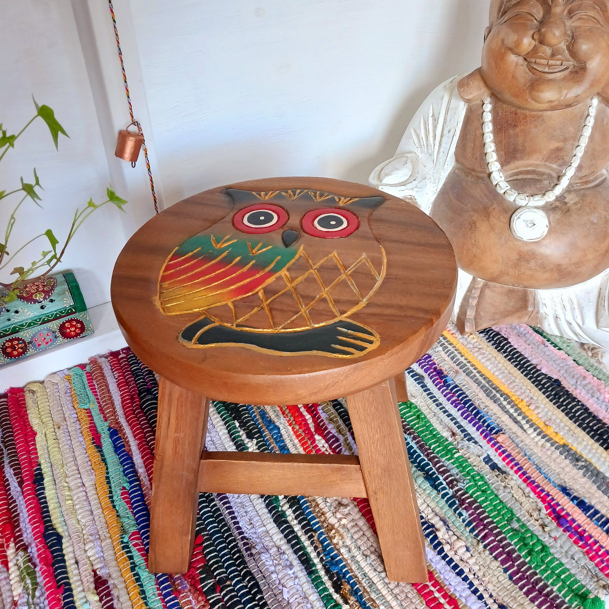 This lovely handmade, carved and painted stool is Fairtrade from Thailand. The top of this stool has been carefully hand carved and then painted to show a beautiful rustic owl. These cheeky little items are very versatile making great stools for little bums or as tiny tables to add accent to your home.