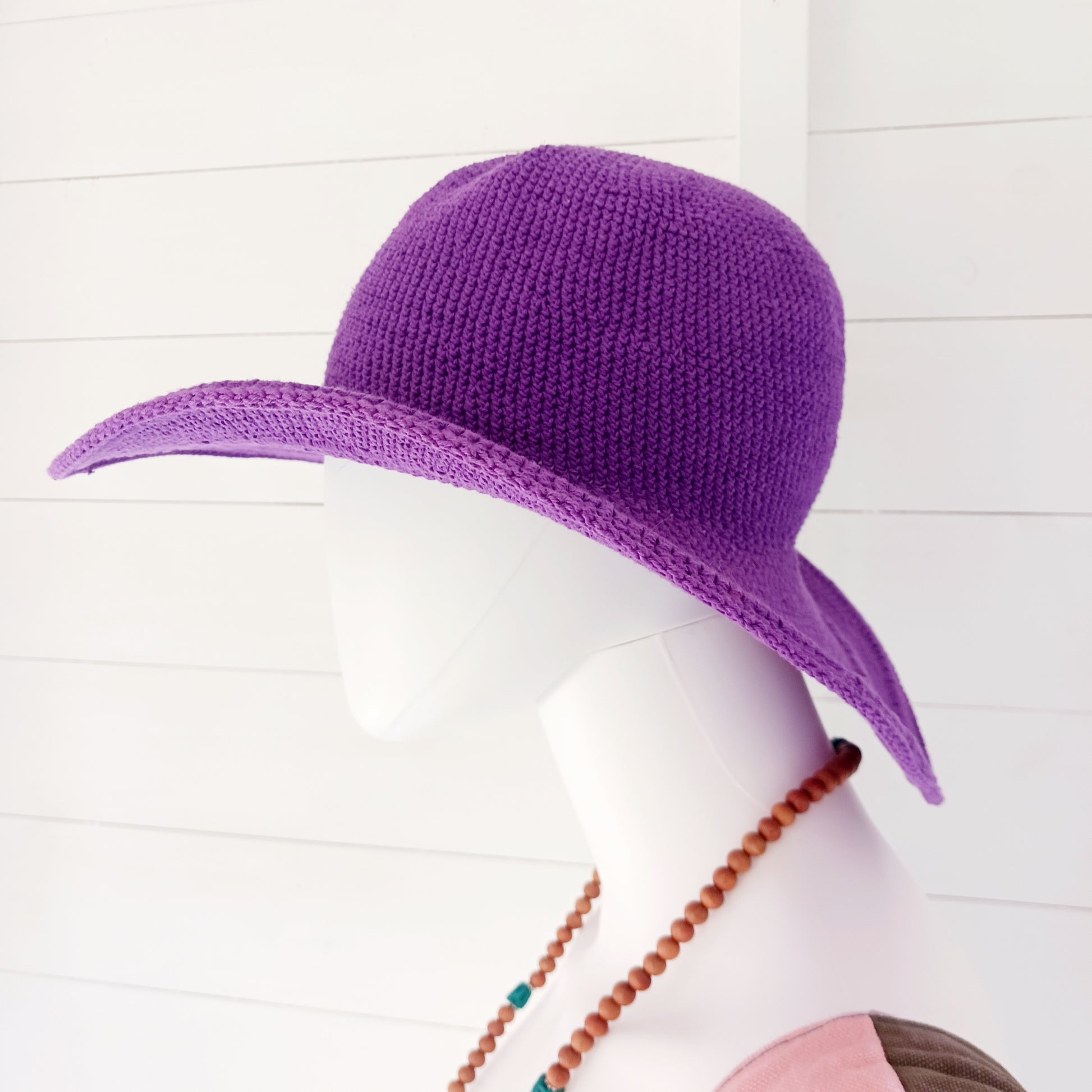 This lovely crochet cotton summer sun hat is perfect for summertime with it's vibrant purple colour.  Each hat has a malleable wire woven into the rim to help keep the shape.  Ideal for holidays and festivals.