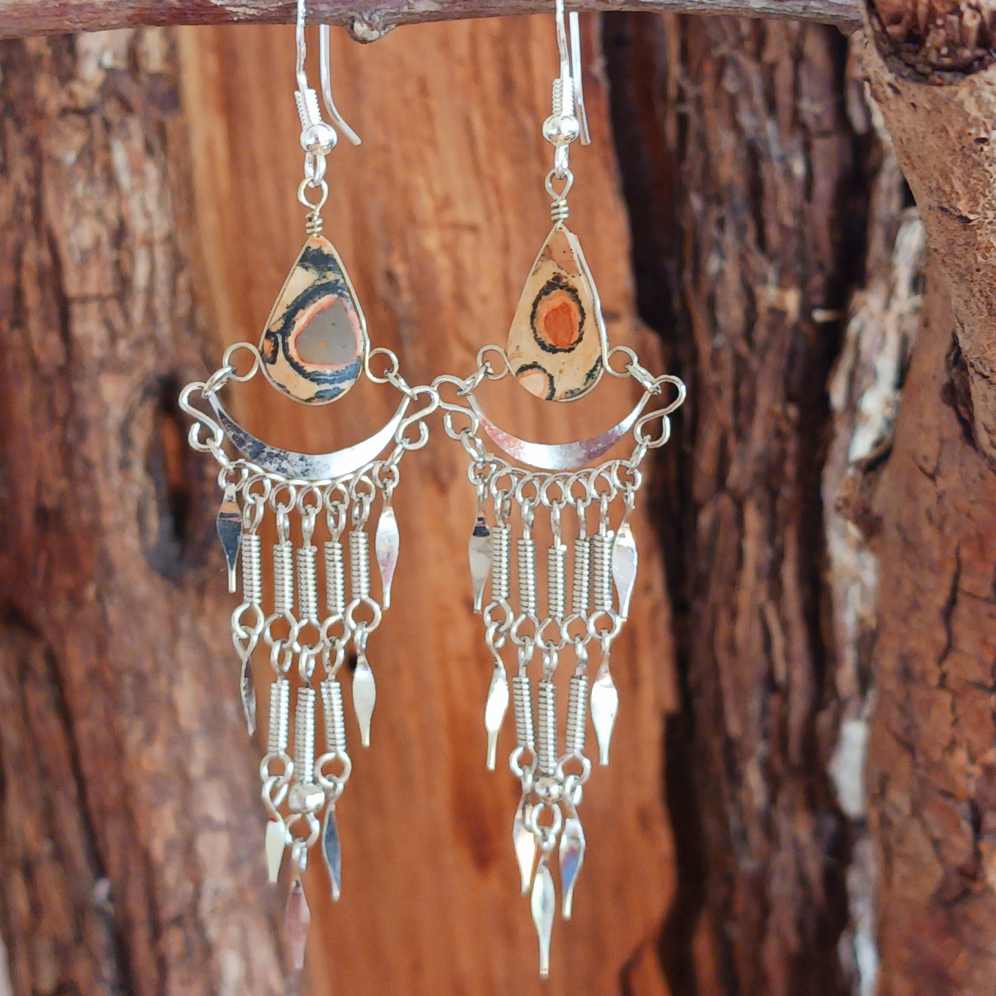 Add a touch of bohemian beauty to your look with these handmade Peruvian stone earrings. Featuring unique brown stones and finished with silver-plated hooks, each pair is carefully crafted in small workshops in Peru.