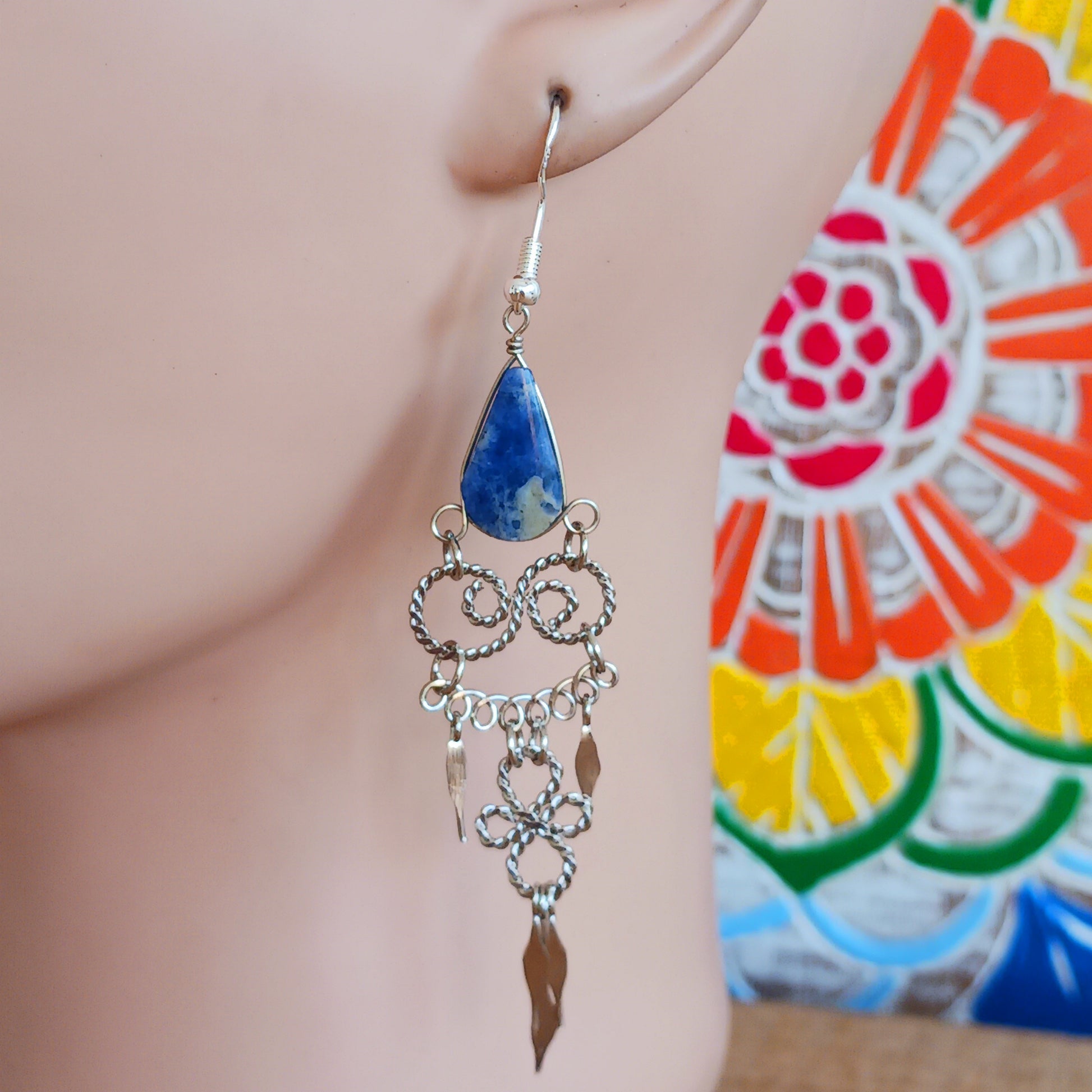 Add a touch of bohemian beauty to your look with these handmade Peruvian stone earrings. Featuring lapis lazuli stones and finished with silver-plated hooks, each pair is carefully crafted in small workshops in Peru.