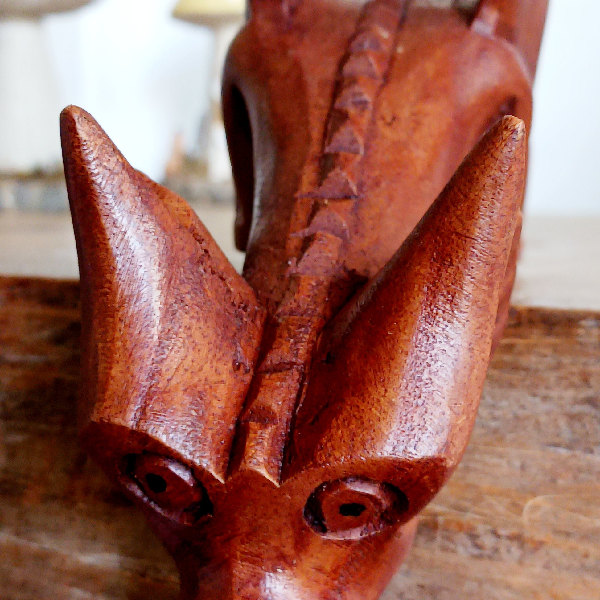 Bring personality and charm into your home with this beautiful hand-carved Shelf Dragon. Expertly crafted with intricate details, this whimsical dragon is designed to perch perfectly on any shelf, mantle, or display space. Its expressive features, artisan carving, and warm natural wood finish make it a captivating accent piece for fantasy lovers, collectors, and anyone who appreciates unique décor.