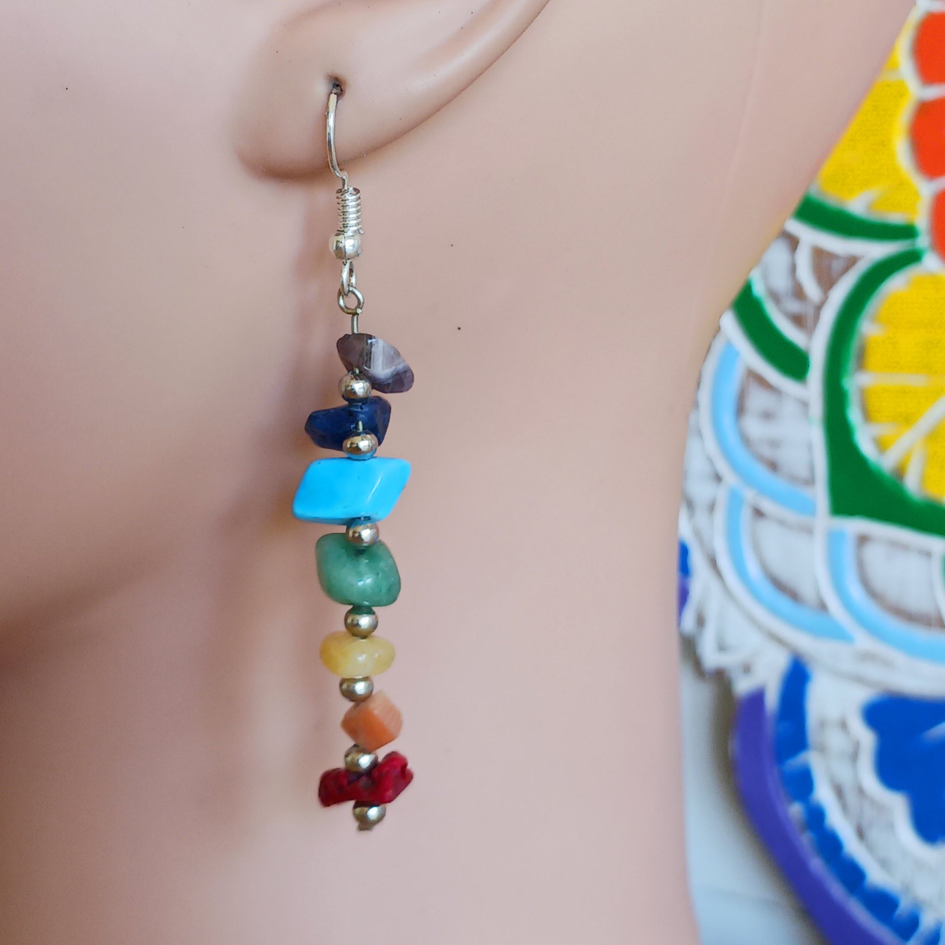These brightly coloured earrings are made from seven gemstones, each representing one of the seven chakras. 
 Ideal for adding to your boho look and keeping you balanced on a night out.