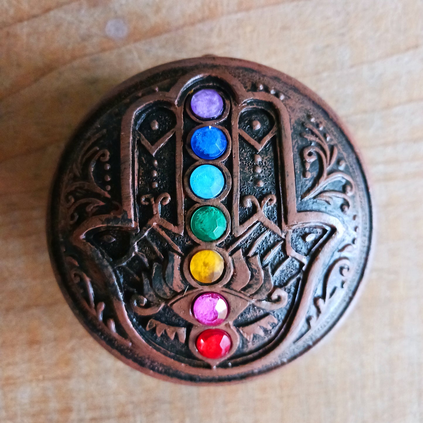 Bring beauty, meaning, and protection into your space with this stunning Chakra Box featuring the Hamsa Hand—a powerful symbol believed to attract happiness, ward off negative energy, and offer spiritual protection.