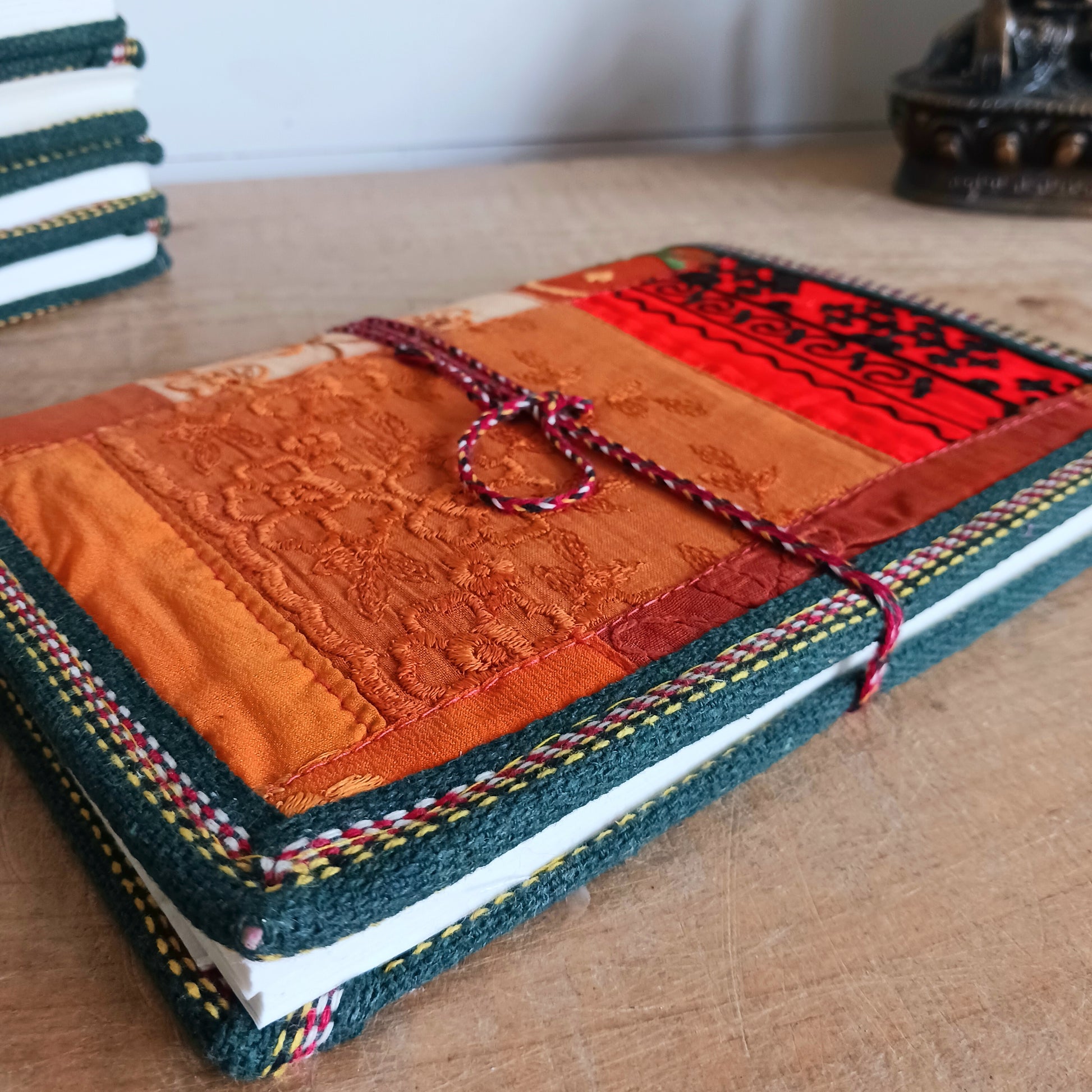This beautifully bound notebook with handmade paper is from recycled cotton. An imaginative use for sari offcut material, the cover is edged and framed with pretty brocade material to complete a lovely and unique eco friendly stationery gift.