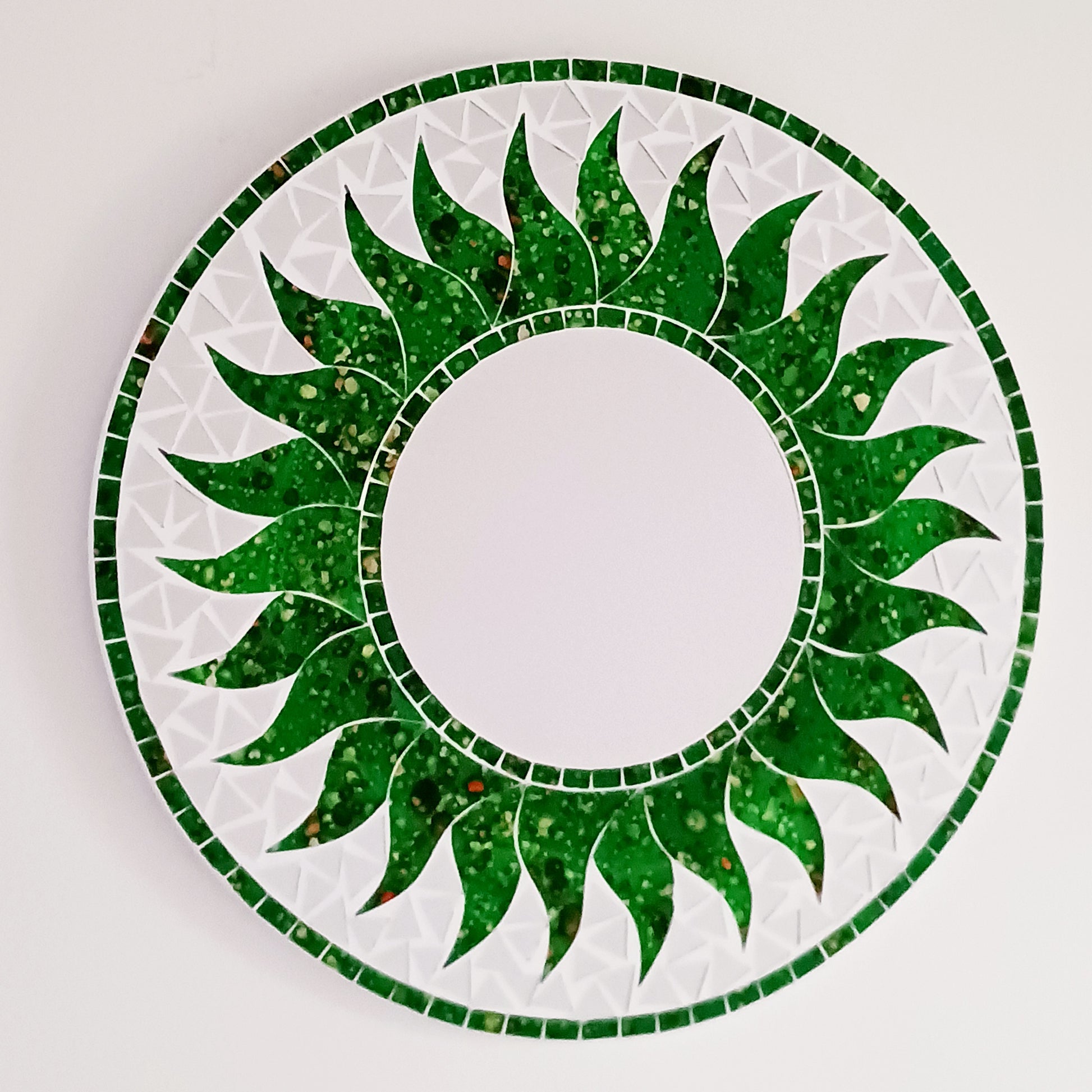 Add warmth, energy, and artistic charm to your home with this beautiful Vibrant Green Mosaic Sun Mirror. Designed with dazzling green mosaic tiles arranged in a radiant sunburst pattern, this captivating wall accent instantly brightens any room.