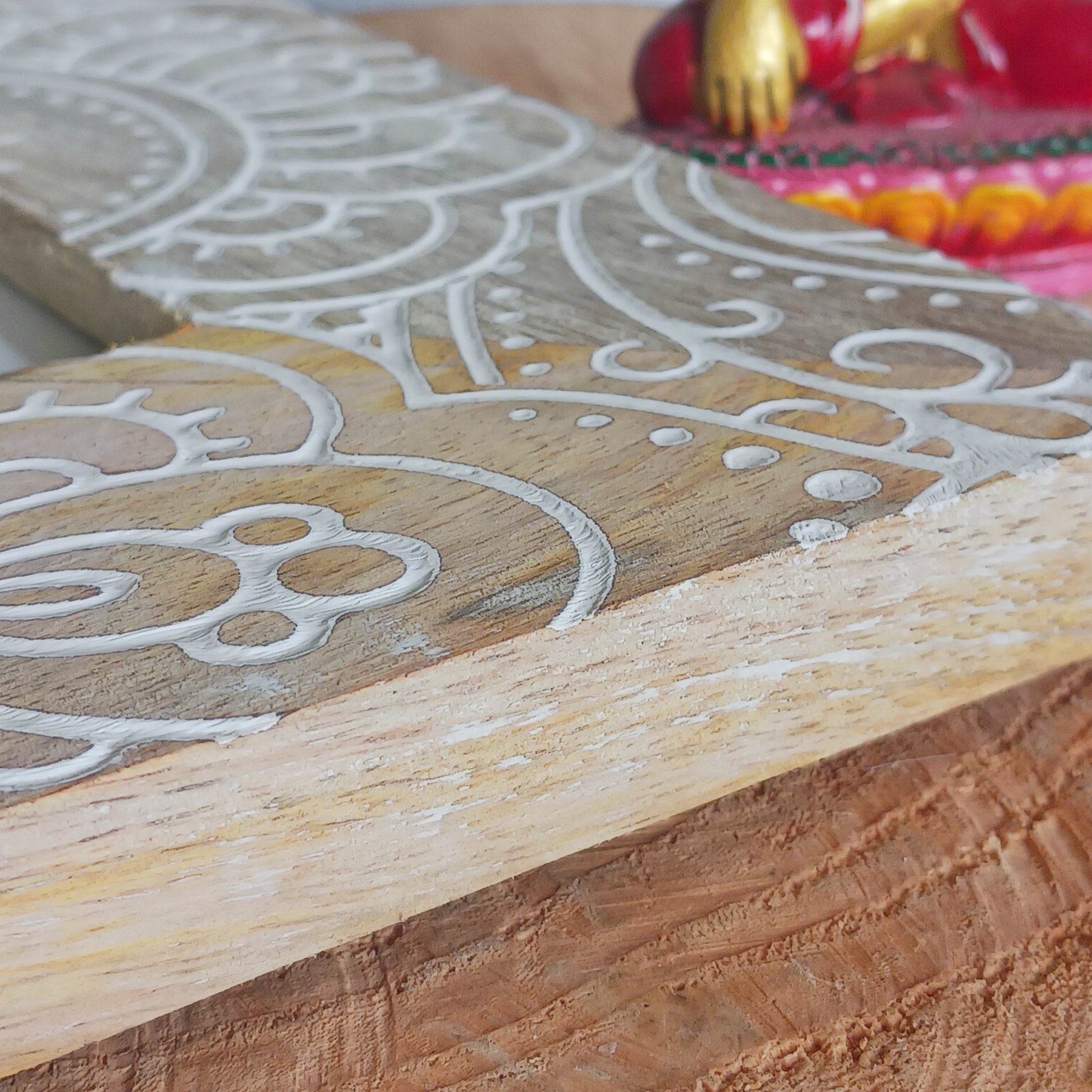 Made in India from sustainably sourced mango wood, these lovely picture frames bring warmth, character, and meaning to any space. Each one is carefully carved or painted with spiritual and cultural designs that go beyond decoration holding deep symbolism and tradition. The small Buddha in the corner is a peaceful presence that represents wisdom and enlightenment. Ideal for meditation spaces, yoga studios, or anyone seeking a sense of calm.
