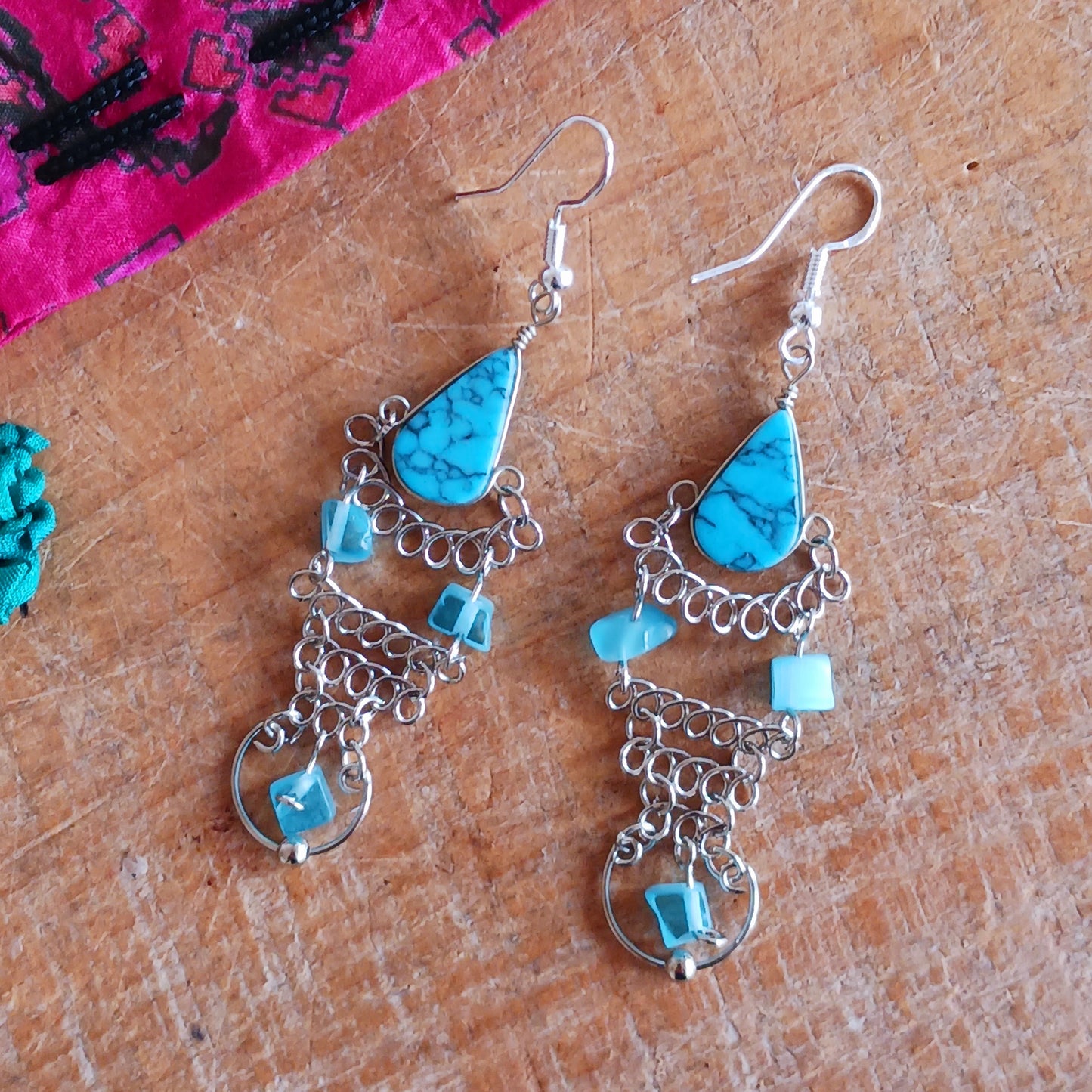 Add a touch of bohemian beauty to your look with these handmade Peruvian turquoise stone and beaded earrings. Featuring turquoise stones and finished with silver-plated hooks, each pair is carefully crafted in small workshops in Peru.