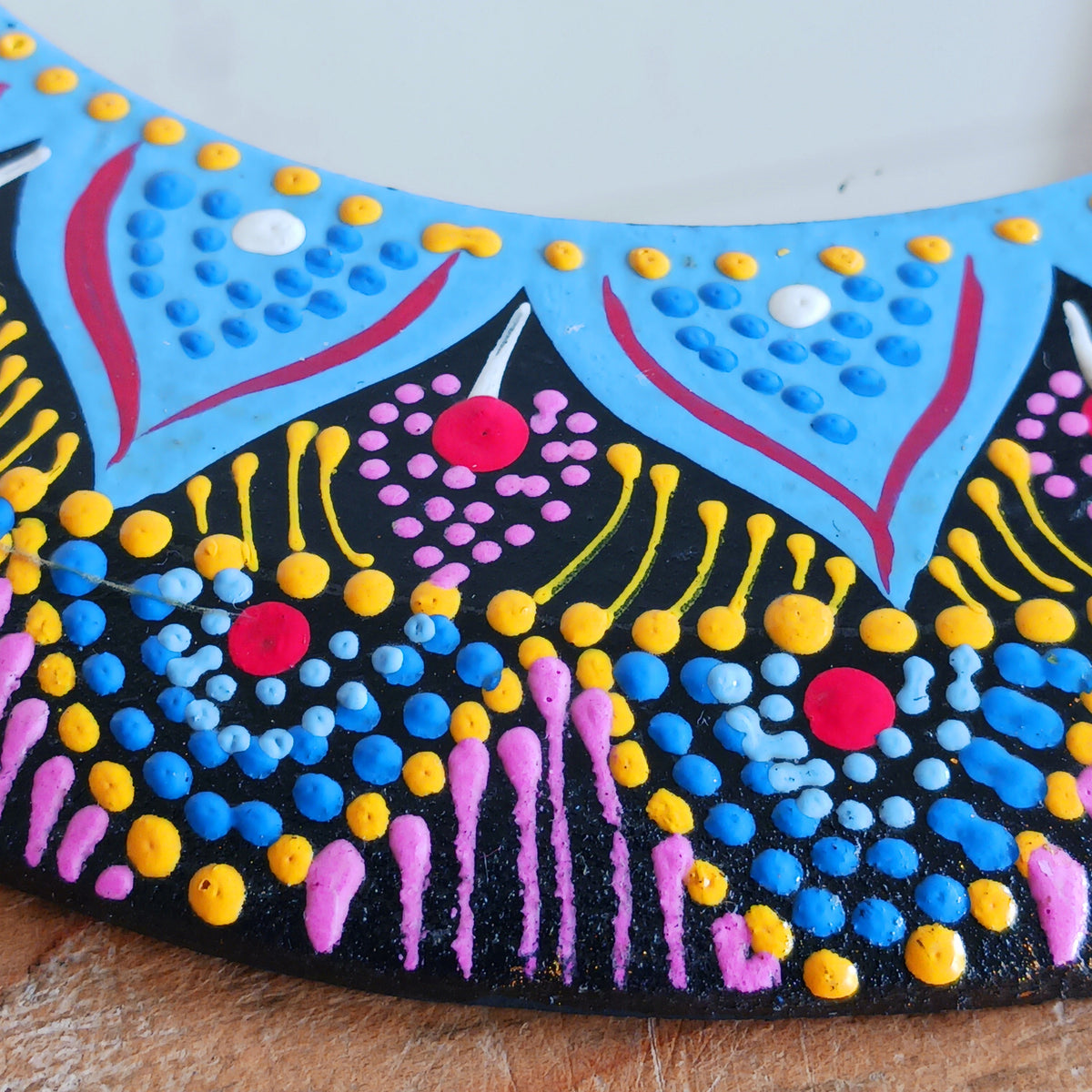 Add a splash of colour and bohemian charm to your home with this beautiful Dot Painted Mirror, handcrafted in Bali by skilled artisans. Featuring a wooden frame decorated with intricate dot painting, its vibrant colours and mandala-inspired patterns create a striking decorative piece that combines everyday practicality with artistic style.