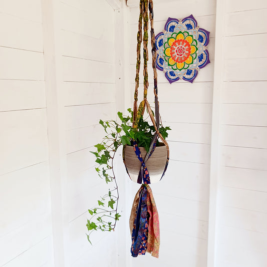 These beautiful sari plant hangers will add a splash of colour and boho chic to your home. Made from scraps of used sari, their simple design ensures that no fabric is wasted but is re-purposed into an elegant product.