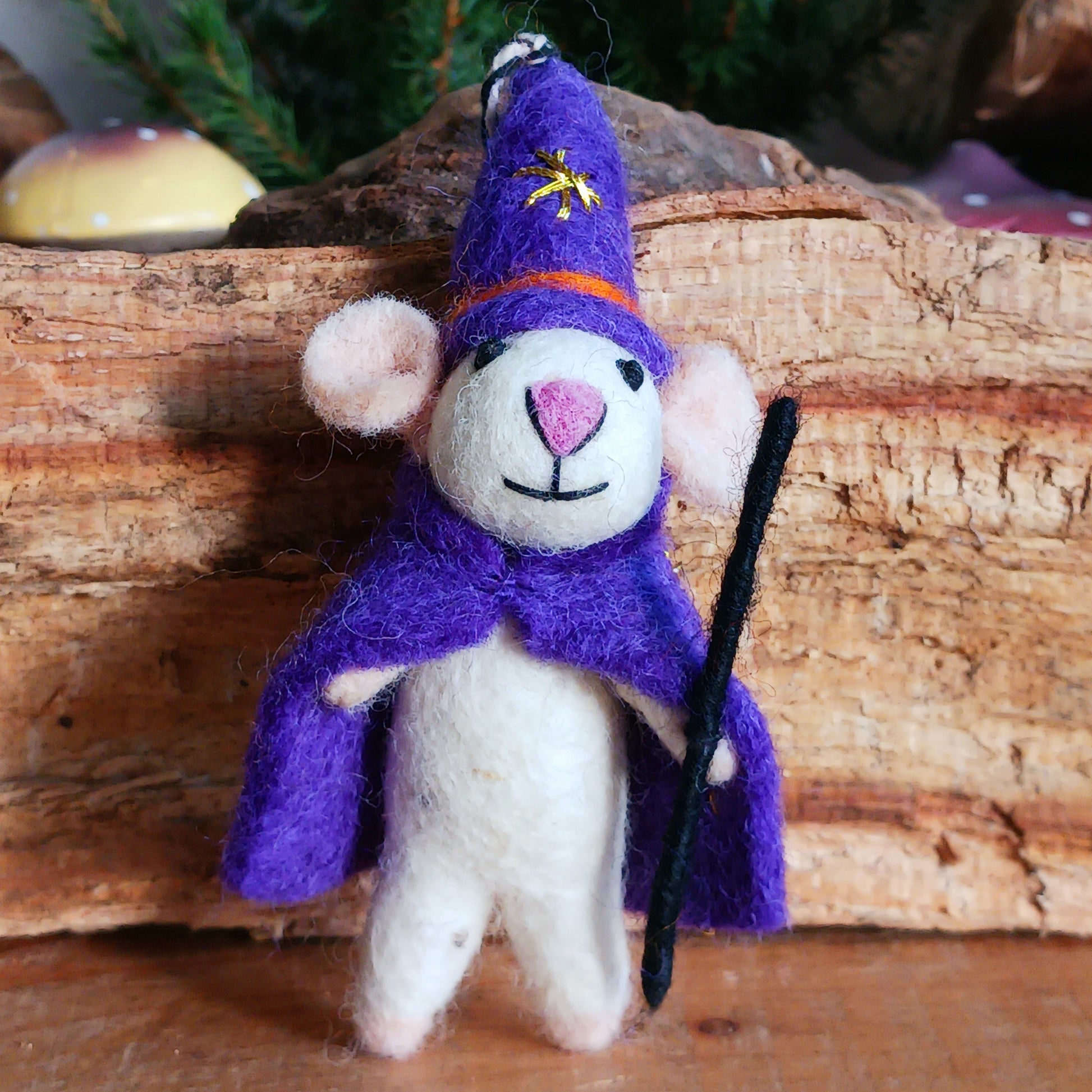 Bring a touch of handcrafted Halloween charm to your home with these delightful felted mice dressed as a Wizard character. Each mouse features adorable details including long tails, soft pink ears and noses, and colourful pointed hats and capes. The Wizard style is elegantly finished with gold star embroidery for extra magical flair.
