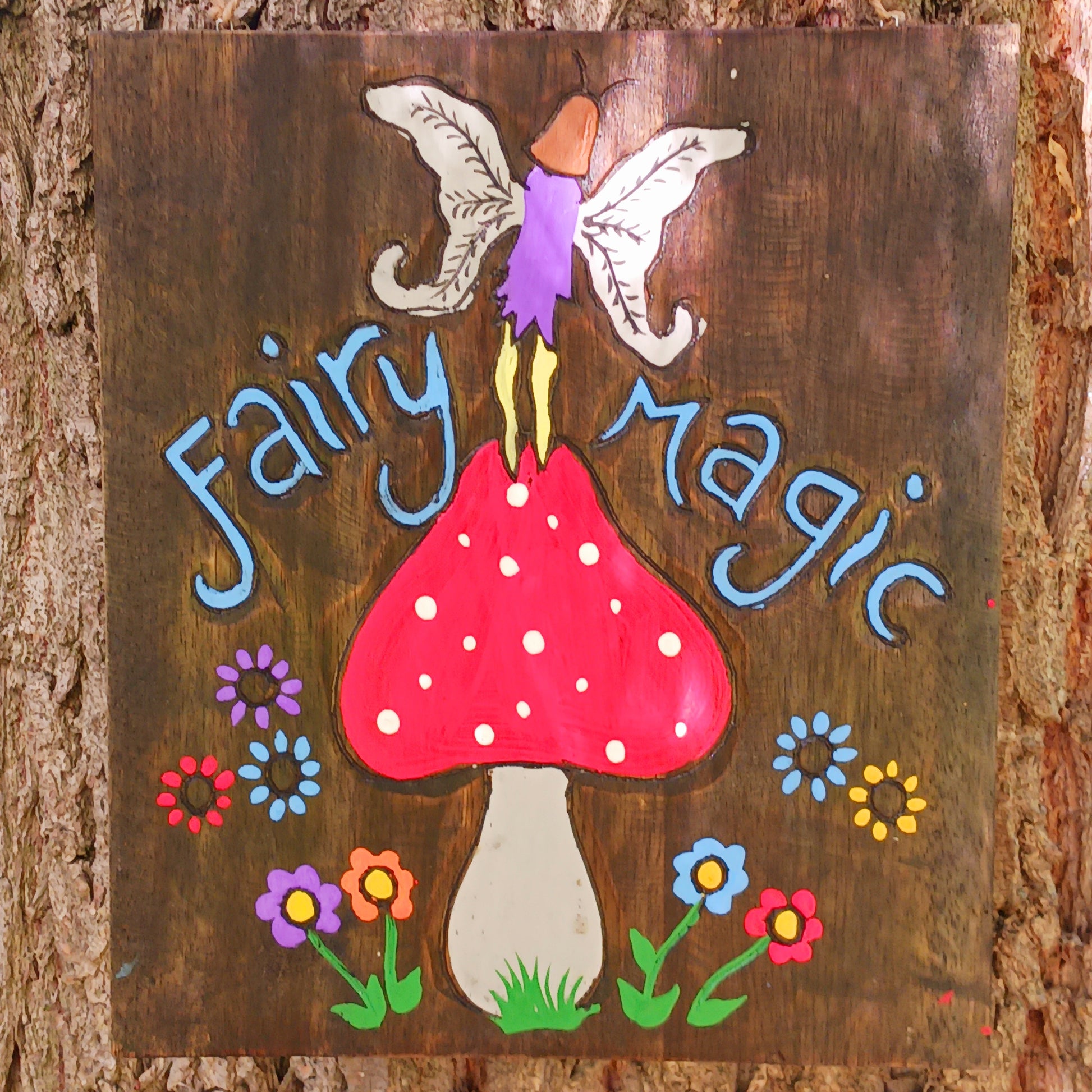Bring a touch of enchantment to your home with this Fairy Magic Handmade Wall Plaque. Beautifully crafted and hand-painted, it features a delightful fairy resting among whimsical mushrooms, perfect for adding charm and colour to any space. Whether displayed indoors or outdoors, this rustic fairy wall art will brighten your surroundings and spark a little magic every day.