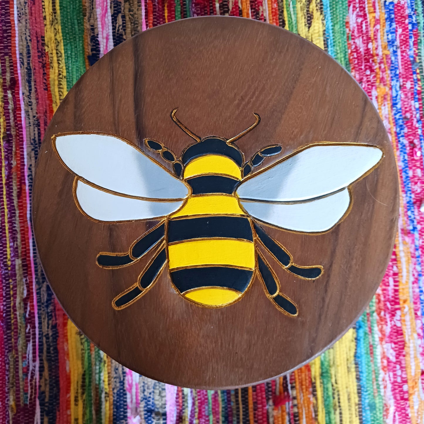 Bring a cheerful touch of handmade charm to your home with this beautiful Fairtrade carved wooden bumble bee stool, lovingly handcrafted and painted by skilled artisans in Thailand.