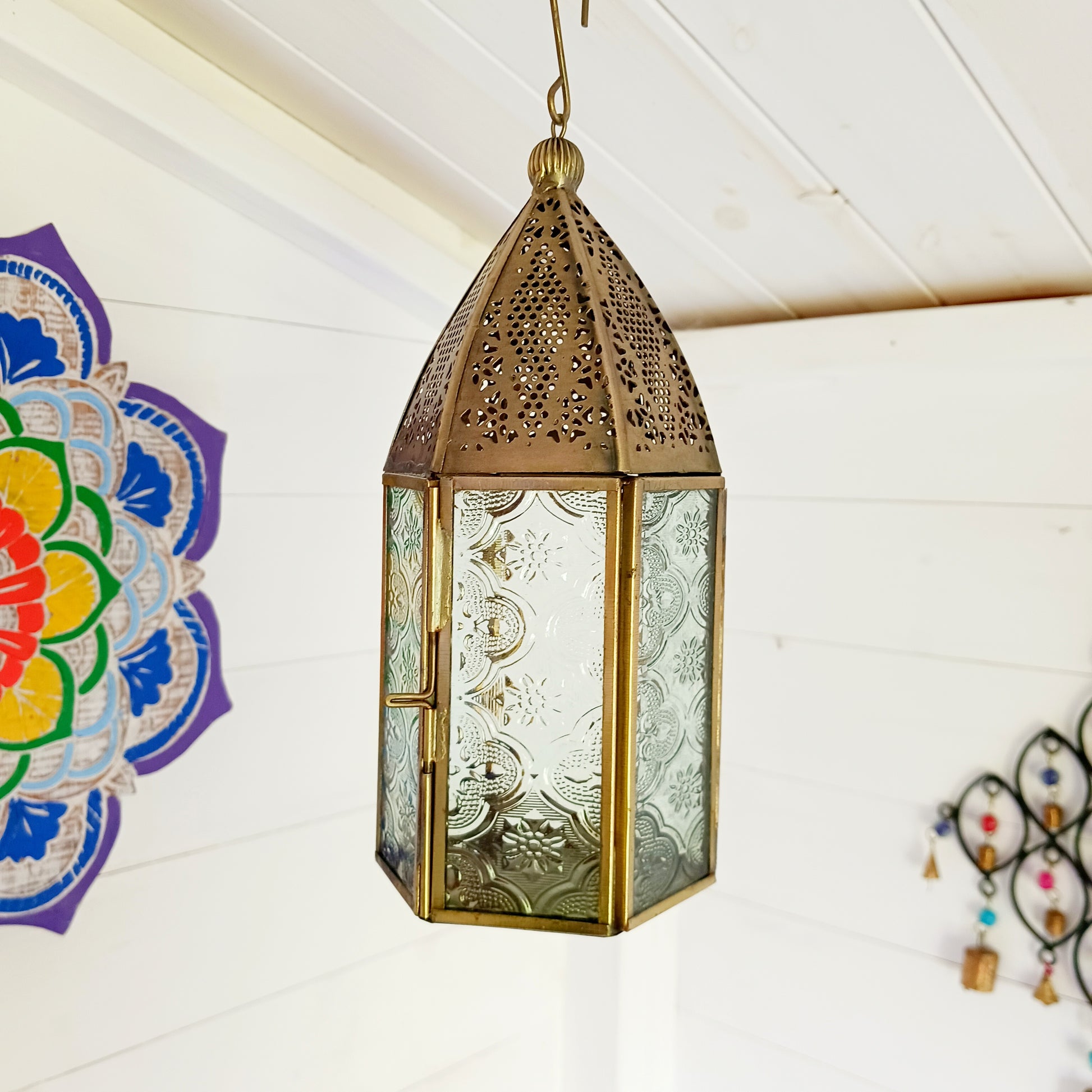 This antique brass Moroccan style large glass lantern has clear embossed glass panes and a wonderful antique finish. A stylish and versatile addition to any home, this beautiful lantern is ideal to bright up your home.
