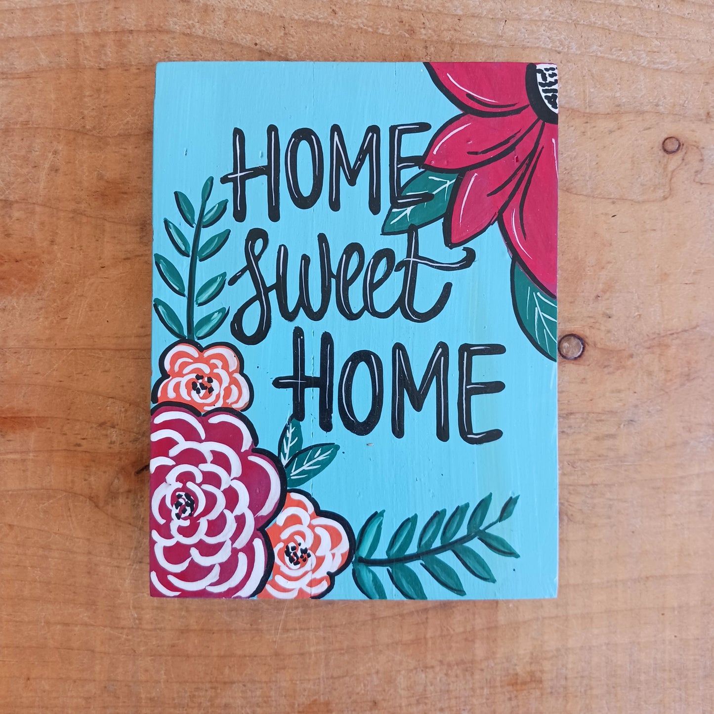 Add warmth and personality to your home with this beautiful Hand Painted Home Sweet Home Wall Plaque. Featuring a vibrant, colourful design and carefully hand-painted finish, this decorative wall plaque is a charming addition to any living room, hallway, kitchen, or entrance.