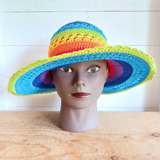 Handmade rainbow crochet sun hat with a flexible brim. Perfect for holidays, beach days & festivals. Unique, lightweight, and ready for sunny adventures!