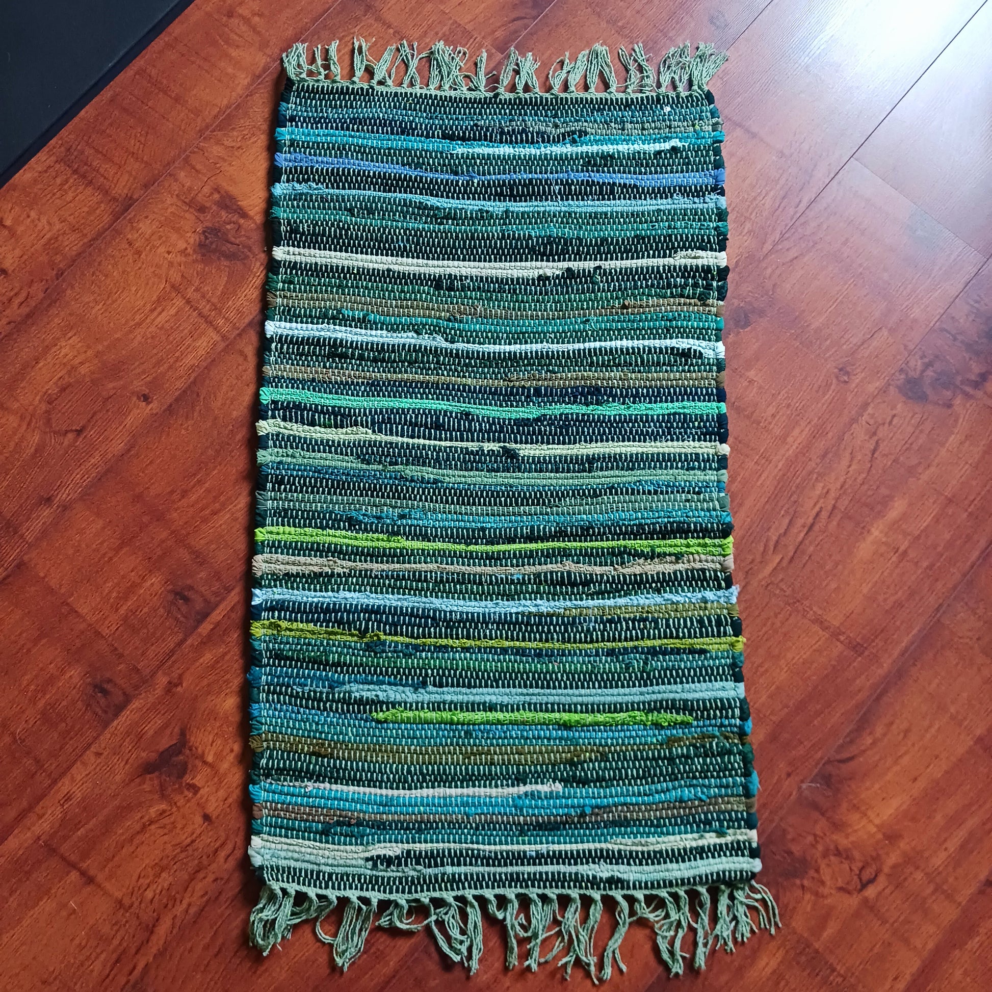 Enhance your living space with this premuim quality rag rug.  Whether used in kitchens, bathrooms, or even as a decorative accent in bedrooms and living rooms, the natural green tones will bring a sense of serenity and freshness to any environment.
