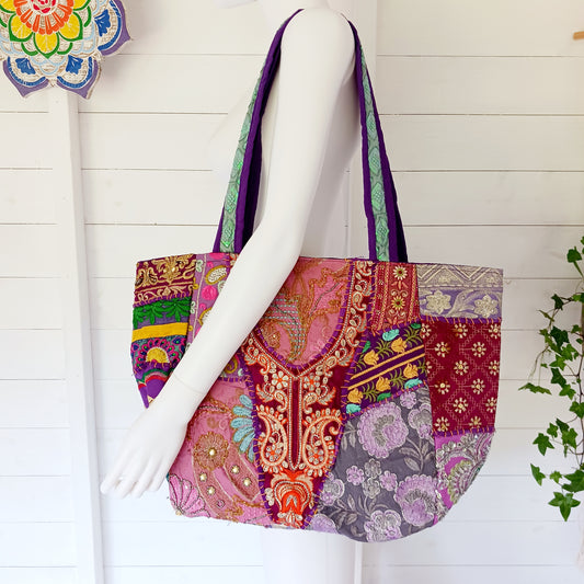 This beautiful large Indian bag comes with a wide shoulder strap and plenty of space inside for your personal items. In a patchwork style design, this bag is intricately embroidered with a traditional bohemian pattern. The bag is fully lined throughout.