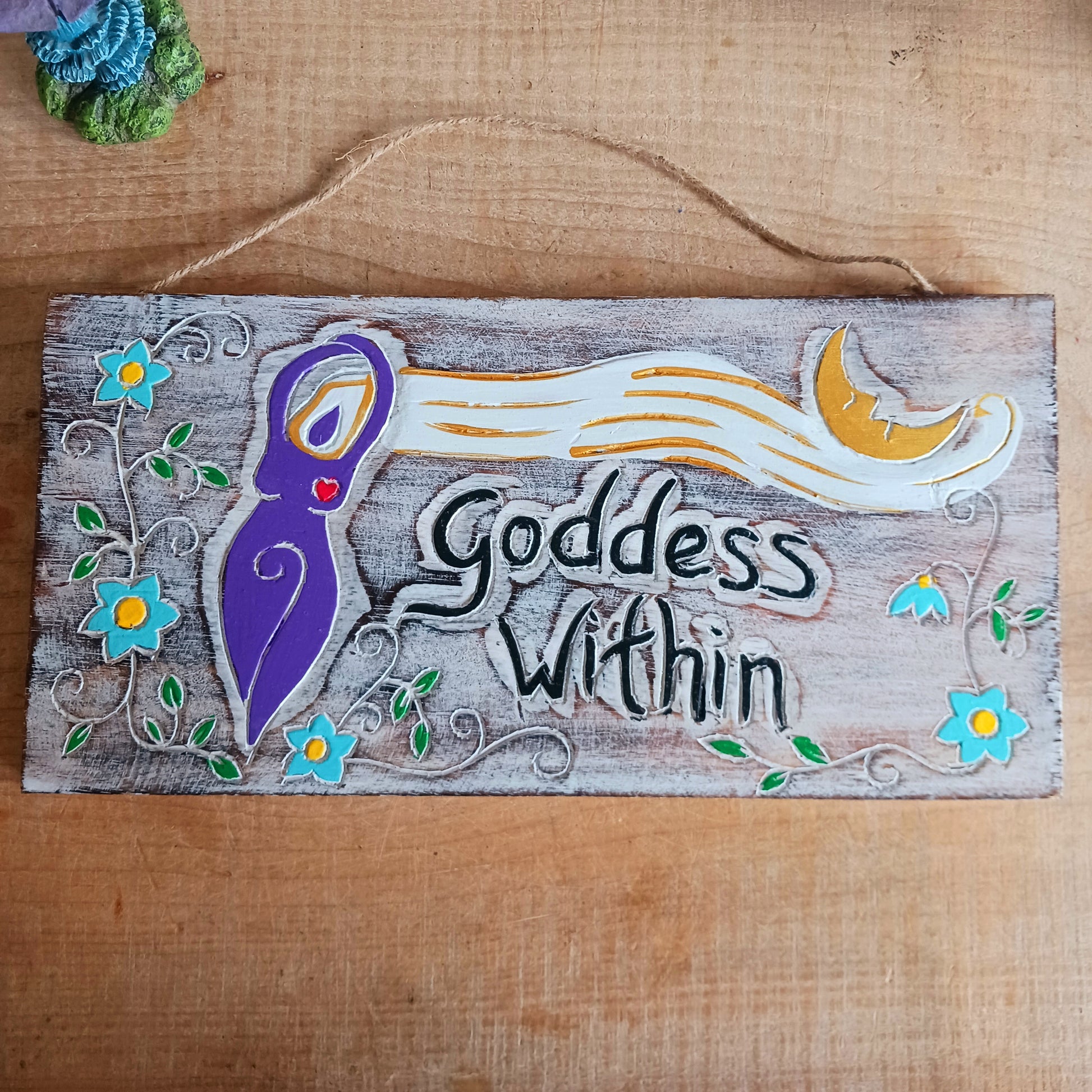 Celebrate your inner strength and feminine energy with this handmade rustic plaque, etched with the empowering message: "Goddess Within" and a beautifully detailed goddess figure. Crafted with care and finished with a sturdy, thick twine cord, this charming piece is perfect for hanging on walls, doors, sheds, or even trees. Whether indoors or out, it's a magical touch for any sacred space or nature-inspired decor.